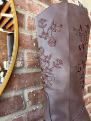 Dark brown Western boot with floral embroidery, pointed toe, and stacked block heel