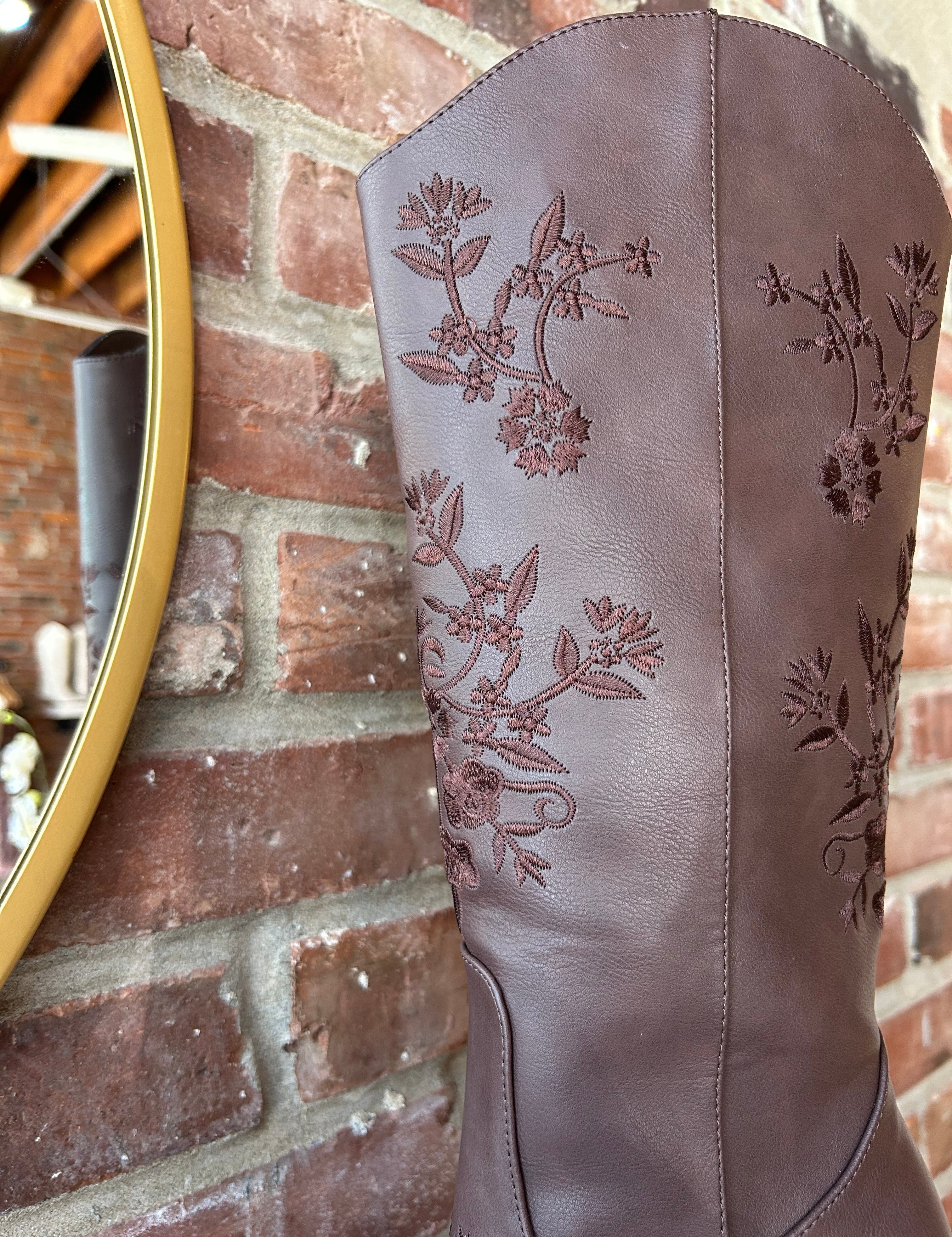 Dark brown Western boot with floral embroidery, pointed toe, and stacked block heel