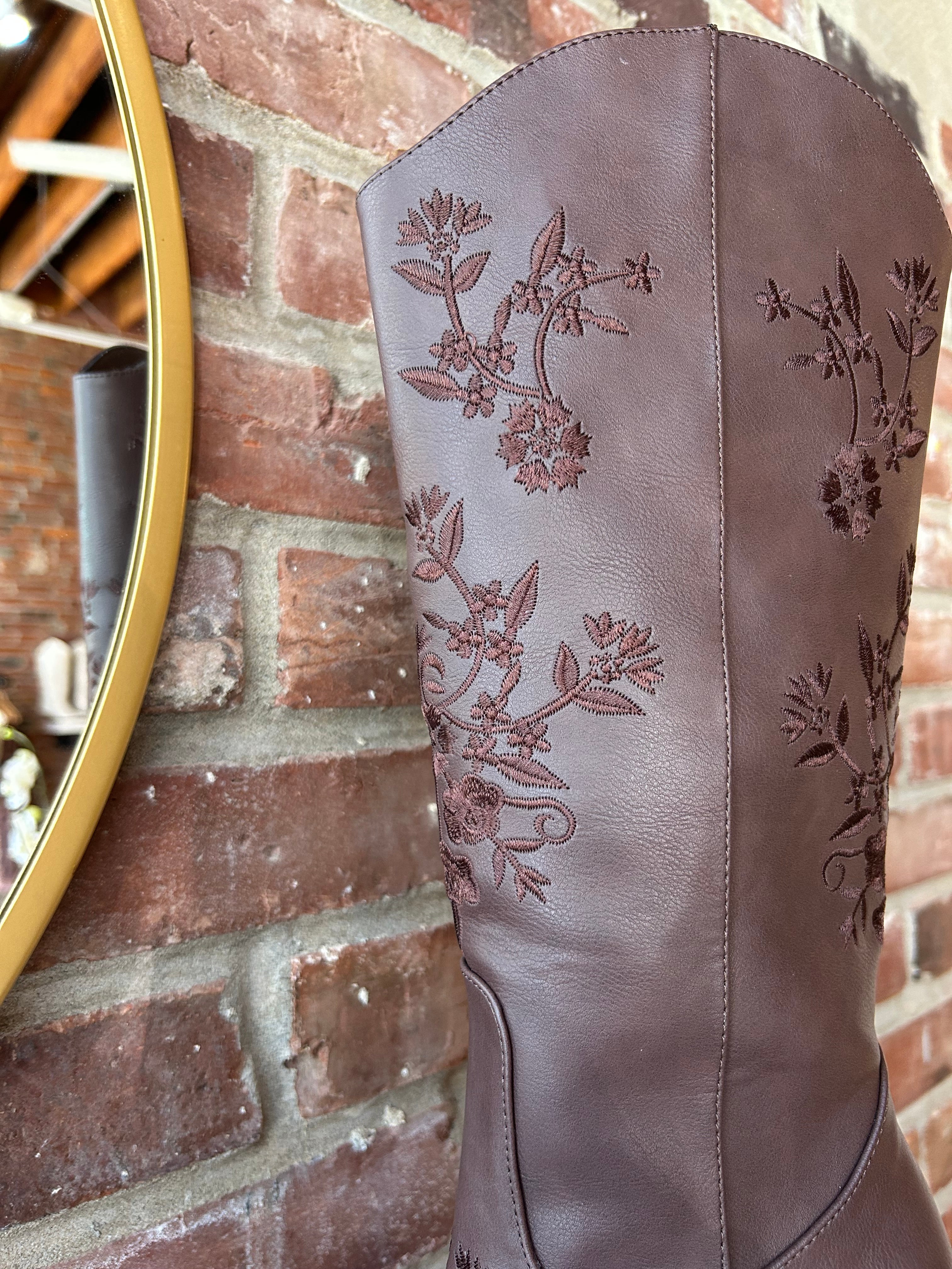 Dark brown Western boot with floral embroidery, pointed toe, and stacked block heel