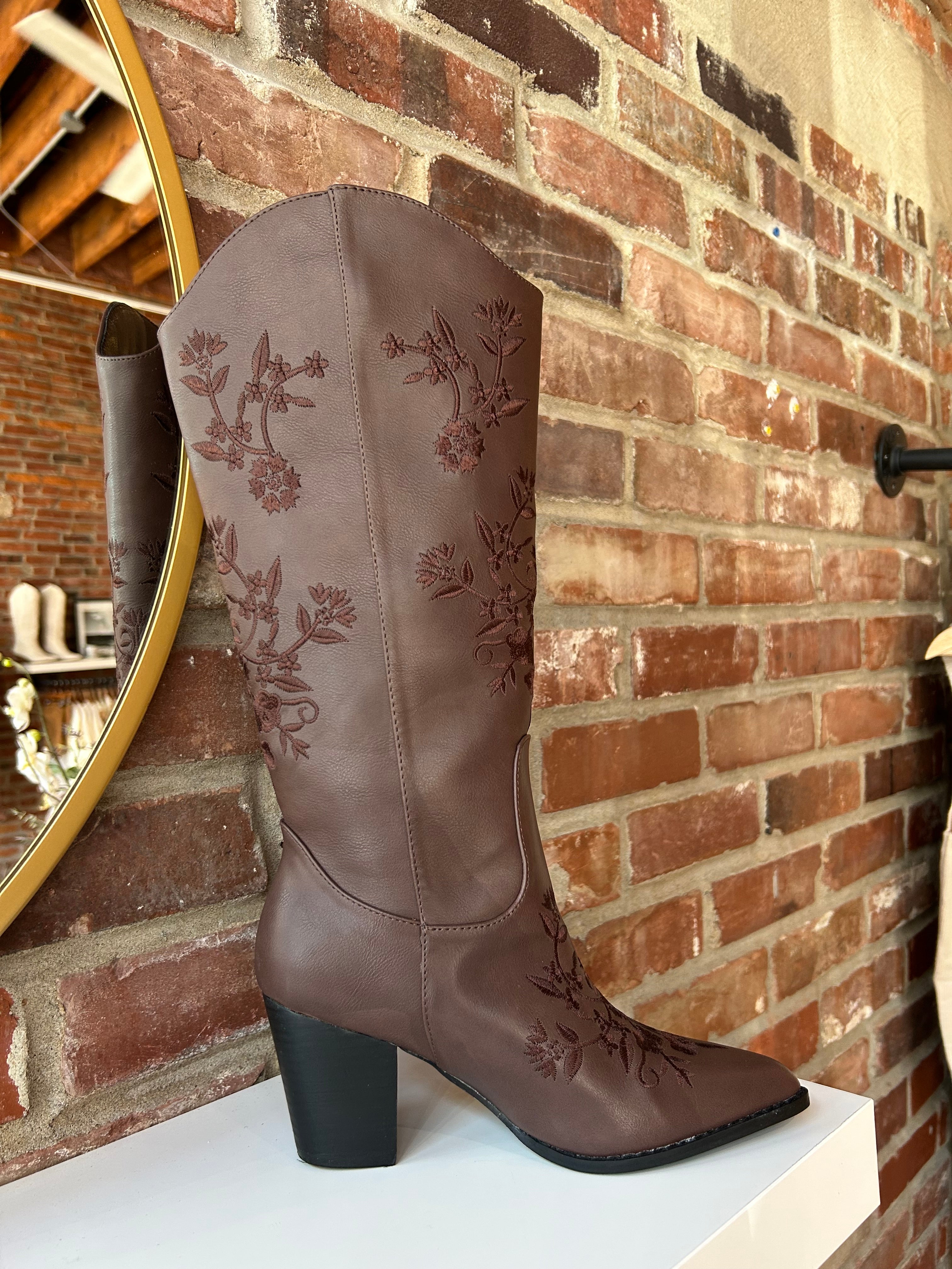 Dark brown Western boot with floral embroidery, pointed toe, and stacked block heel