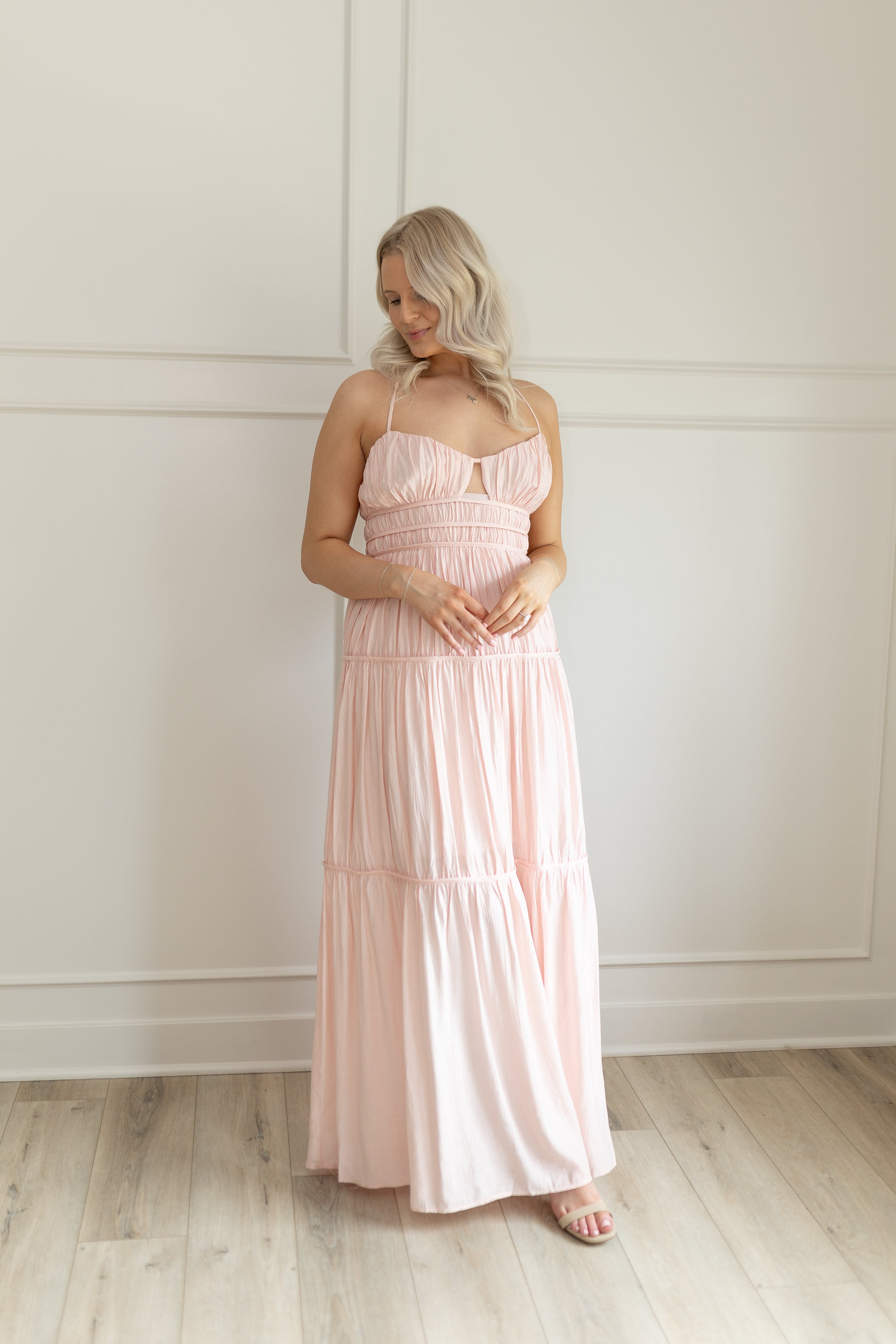 Pink ruched maxi dress with strappy back and tiered flowy skirt