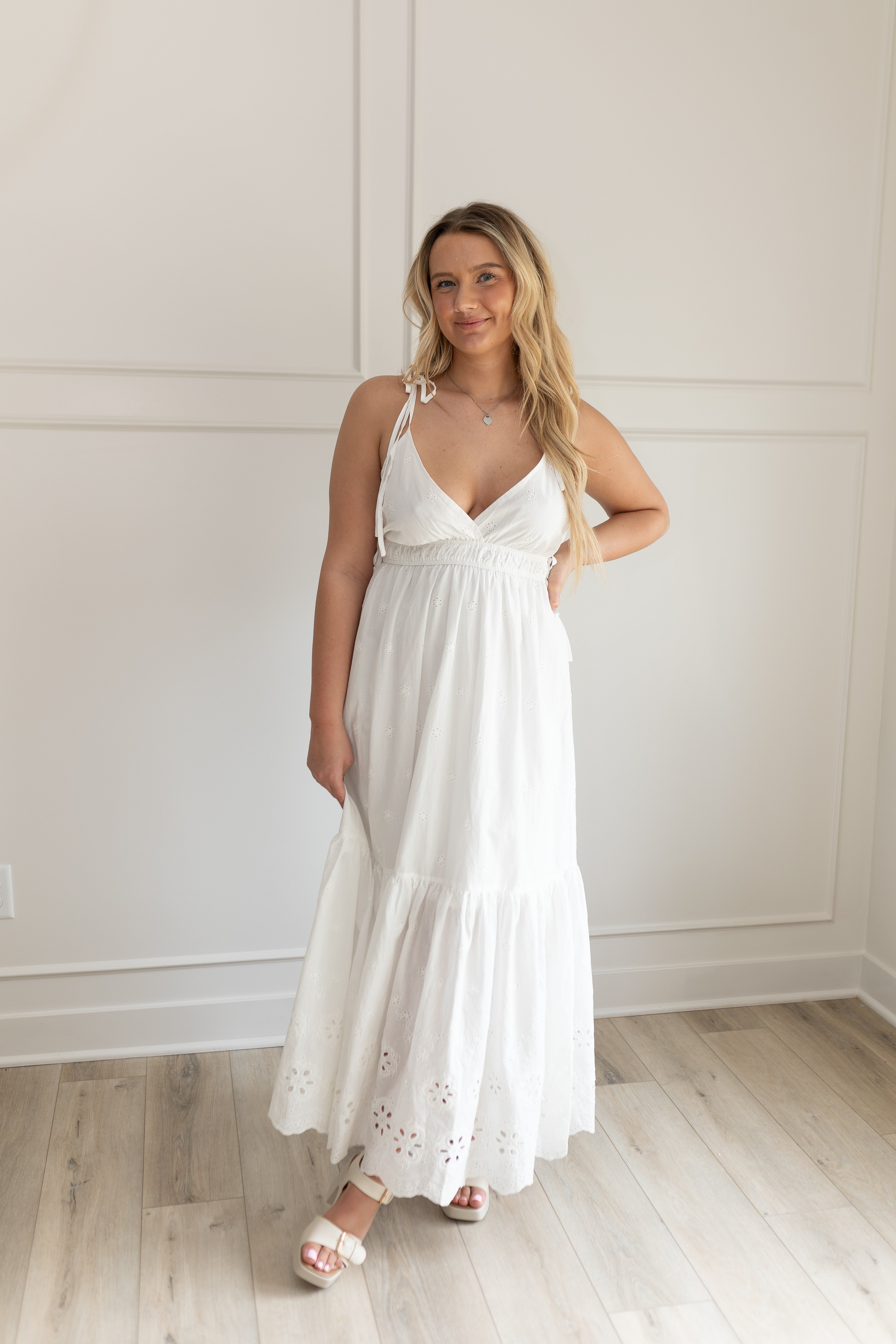 White maxi dress with eyelet embroidered pattern. Adjustable for straps. Also comes in lavender. 