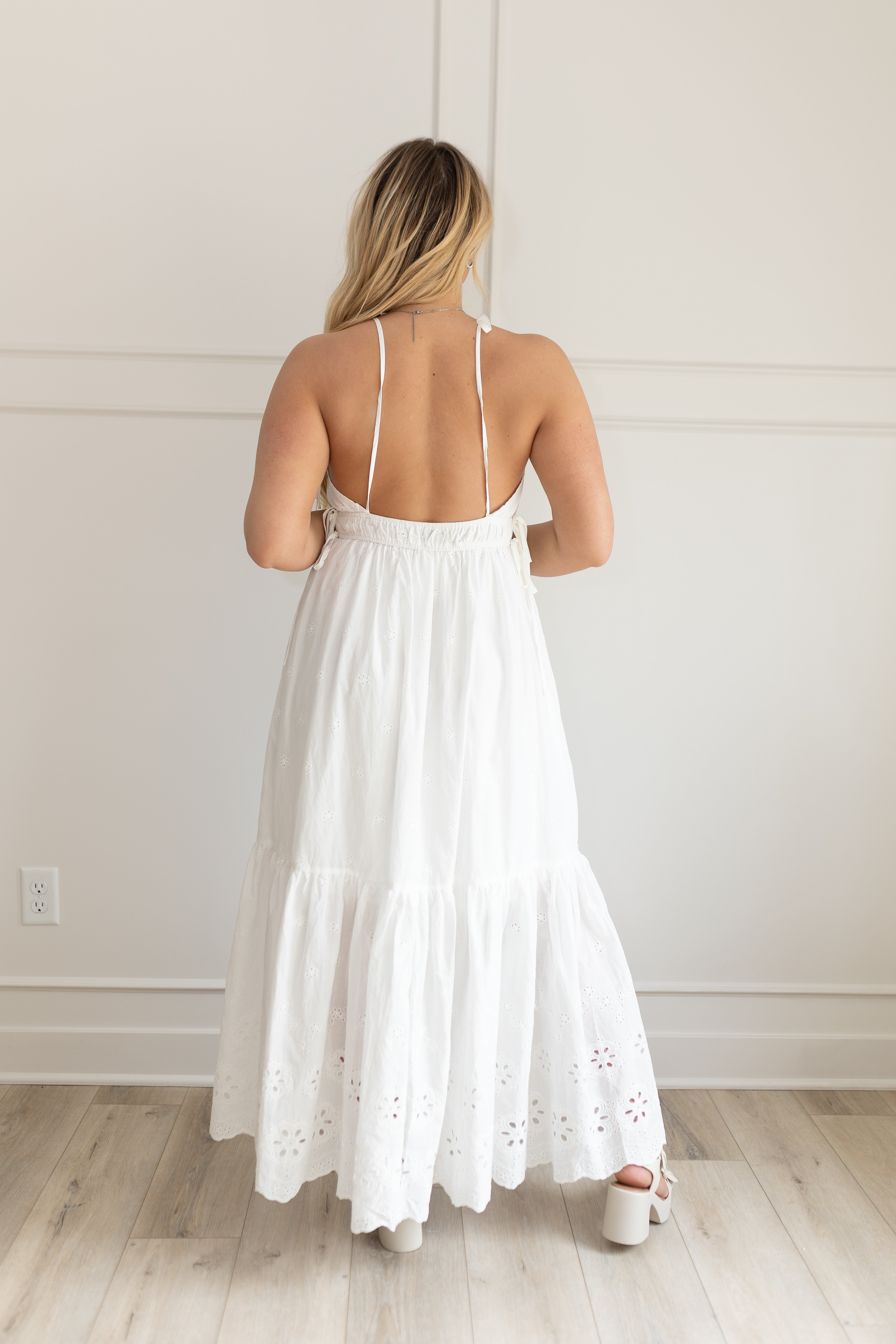 White maxi dress with eyelet embroidered pattern. Adjustable for straps. Also comes in lavender. 
