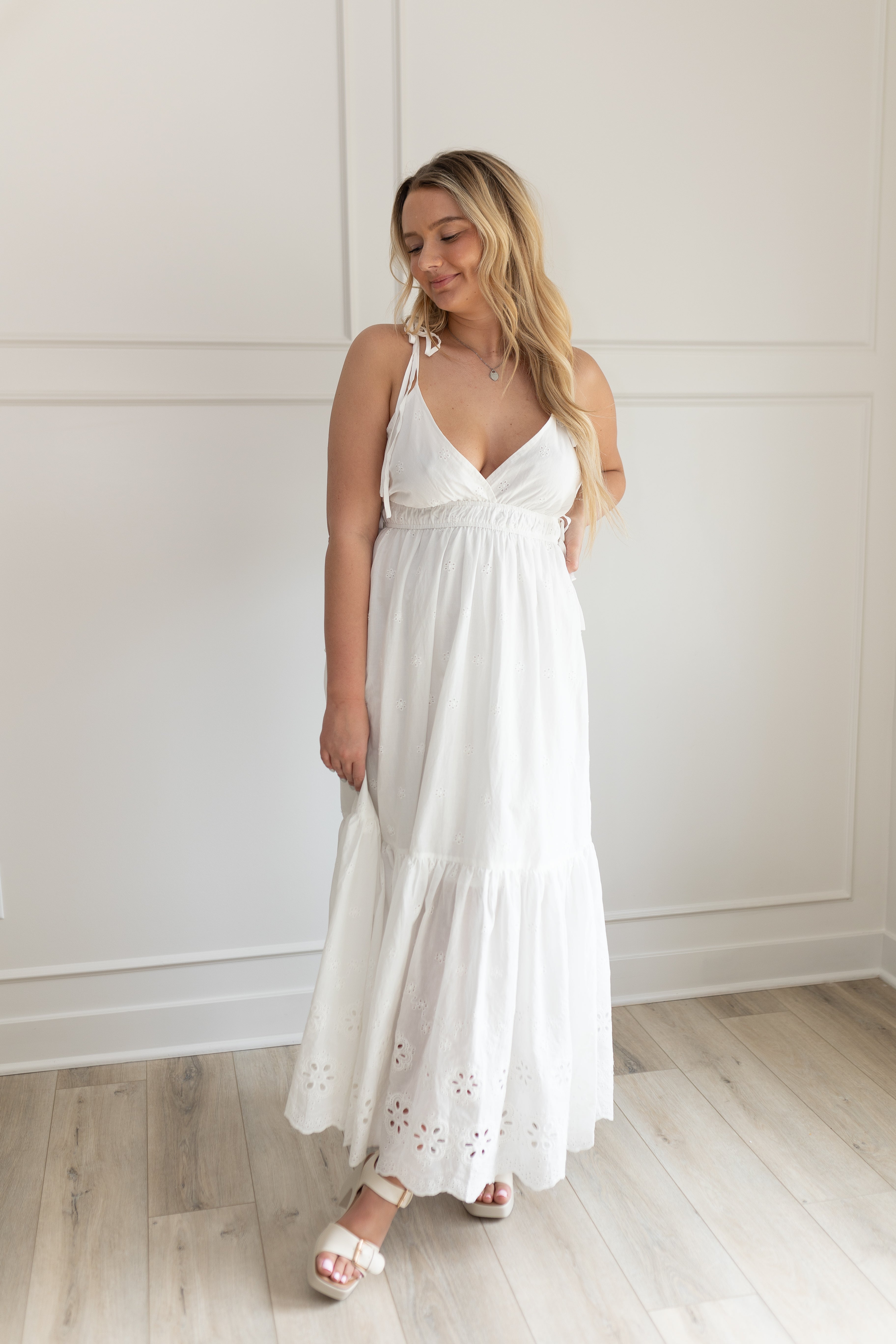 White maxi dress with eyelet embroidered pattern. Adjustable for straps. Also comes in lavender. 