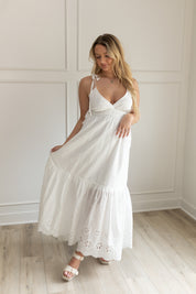White maxi dress with eyelet embroidered pattern. Adjustable for straps. Also comes in lavender. 