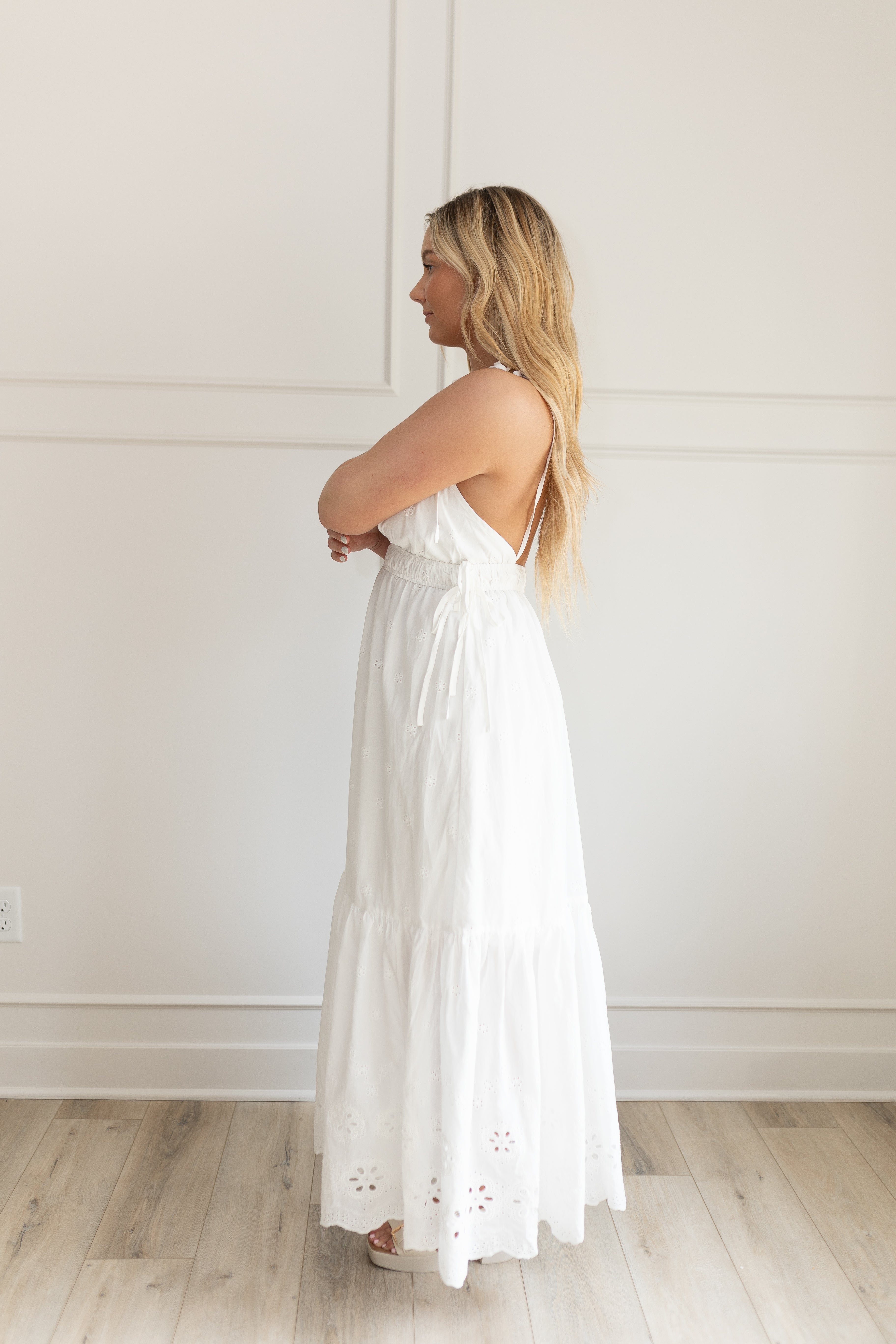 White maxi dress with eyelet embroidered pattern. Adjustable for straps. Also comes in lavender. 