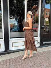 Brown linen ruched midi dress with cutout detail and open back.