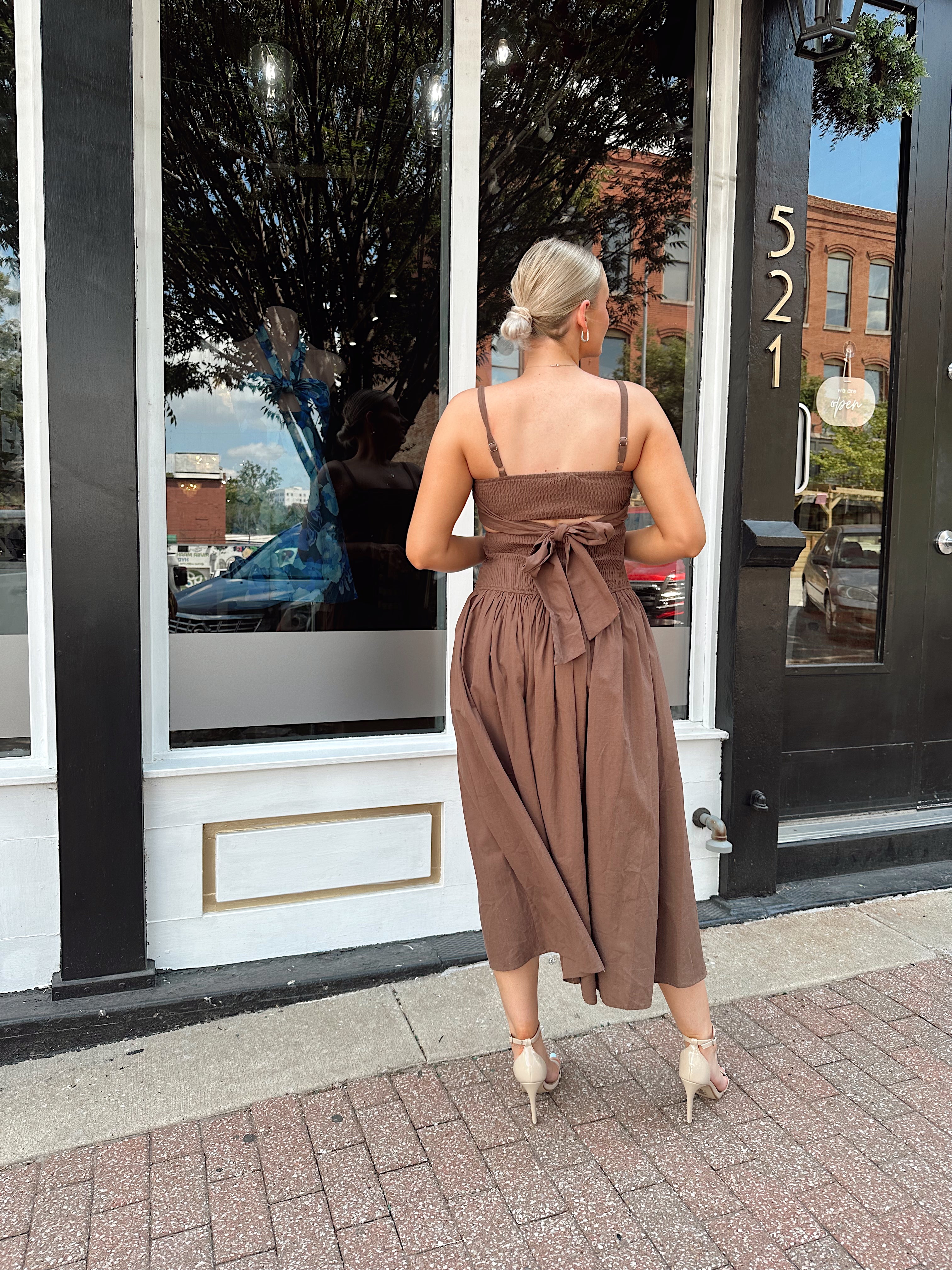 Brown linen ruched midi dress with cutout detail and open back.