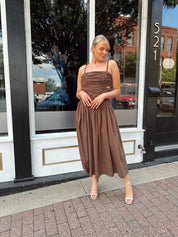 Brown linen ruched midi dress with cutout detail and open back.