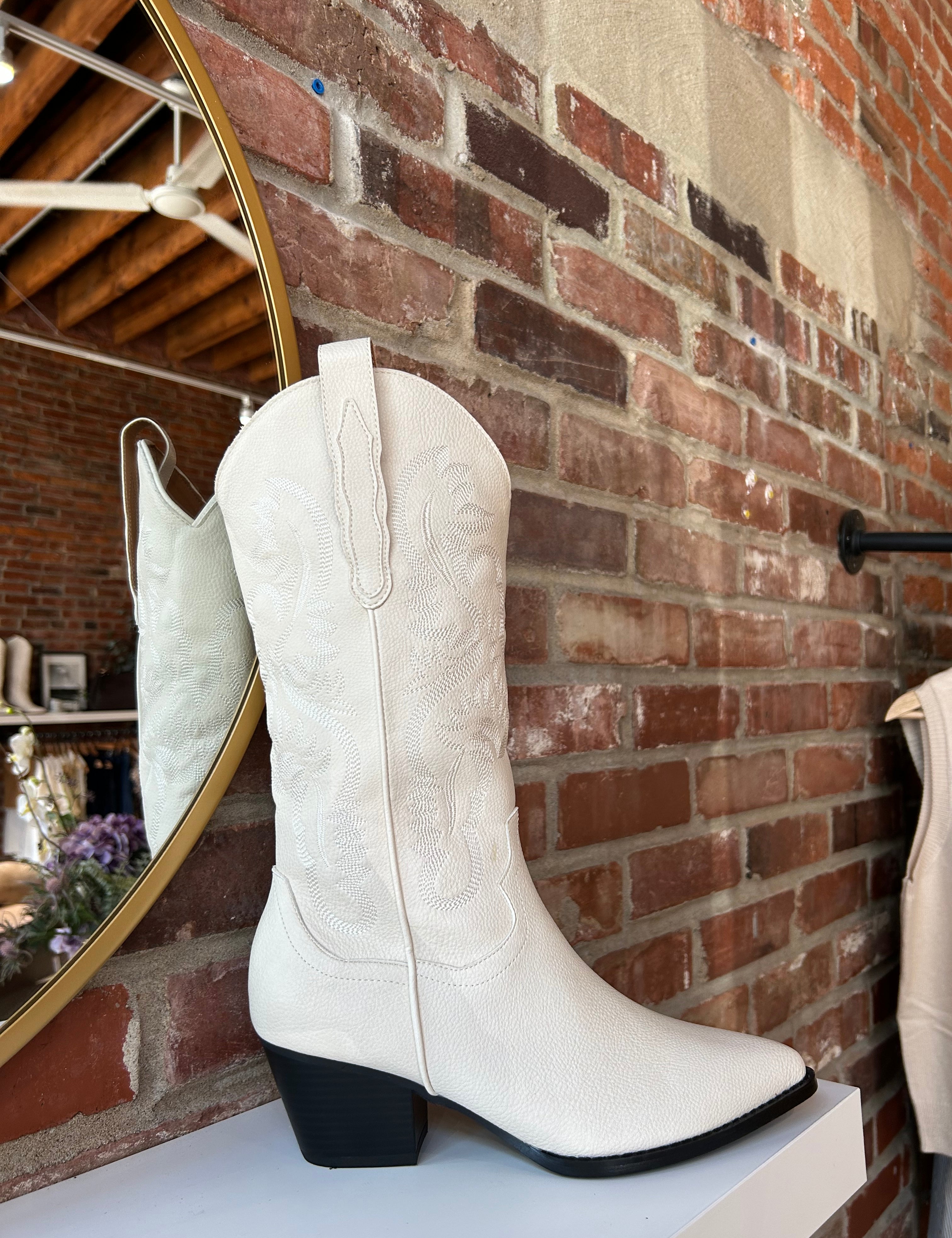 Off white Western boot with tonal embroidery, pointed toe, and stacked block heel