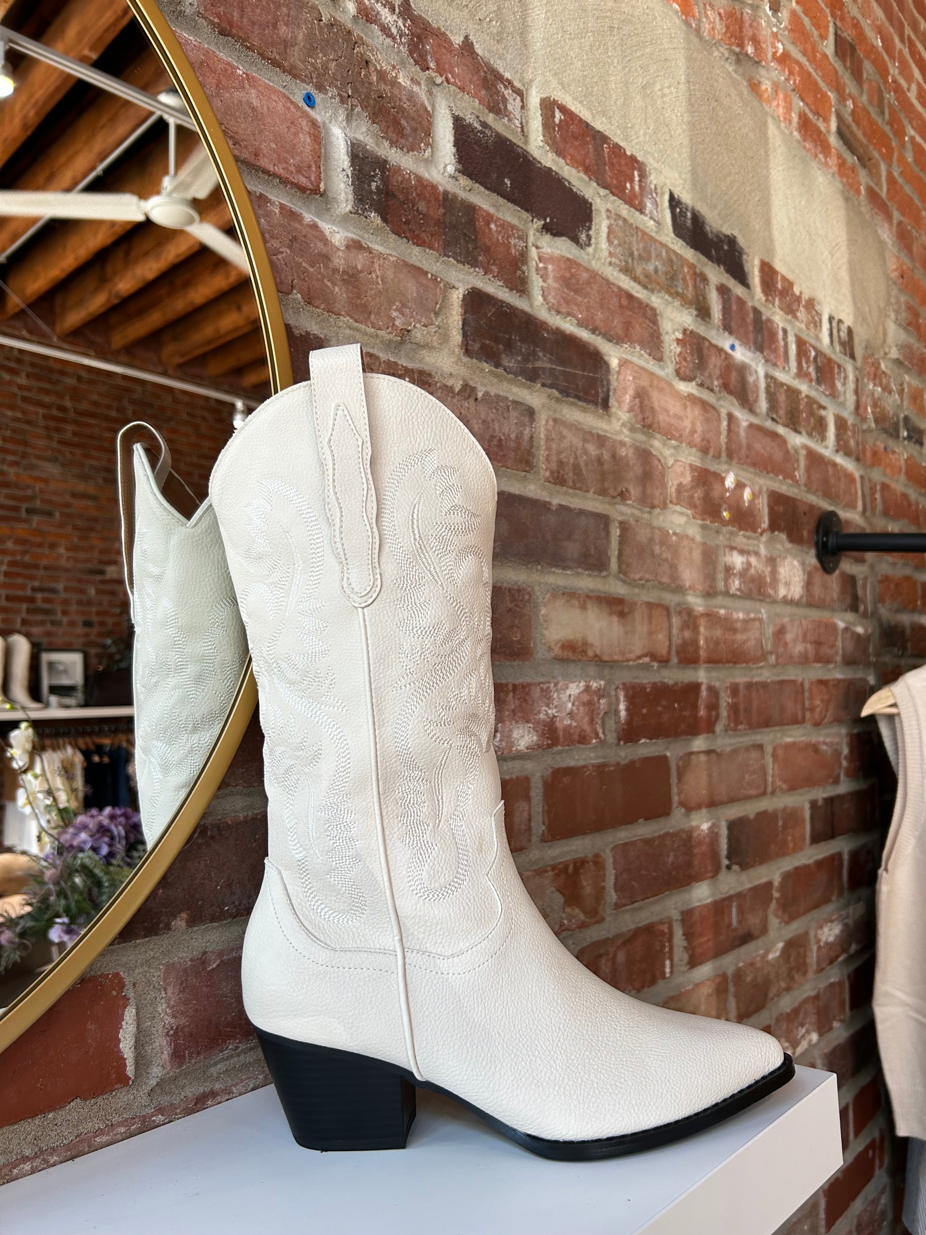 Off white Western boot with tonal embroidery, pointed toe, and stacked block heel