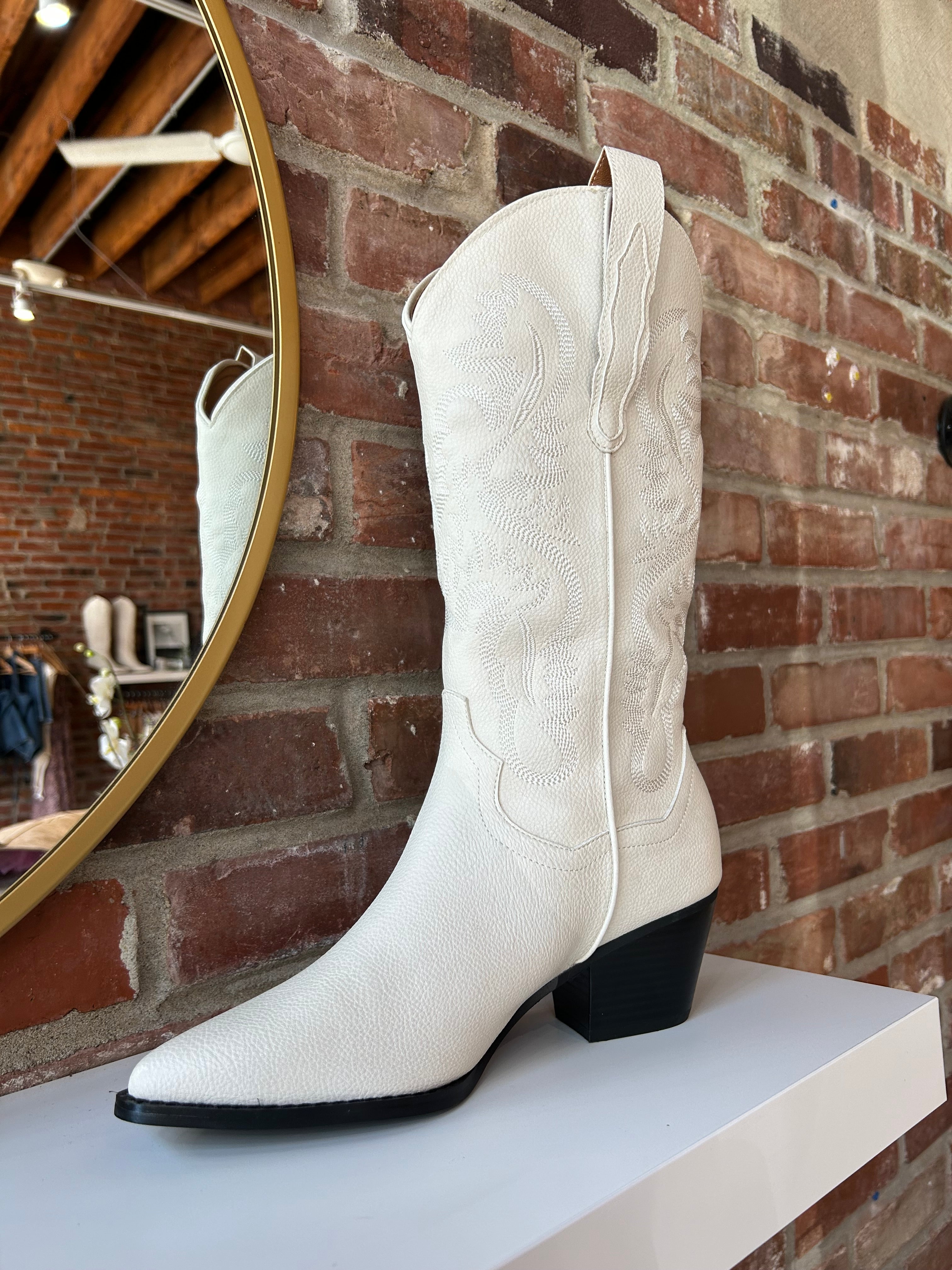 Off white Western boot with tonal embroidery, pointed toe, and stacked block heel