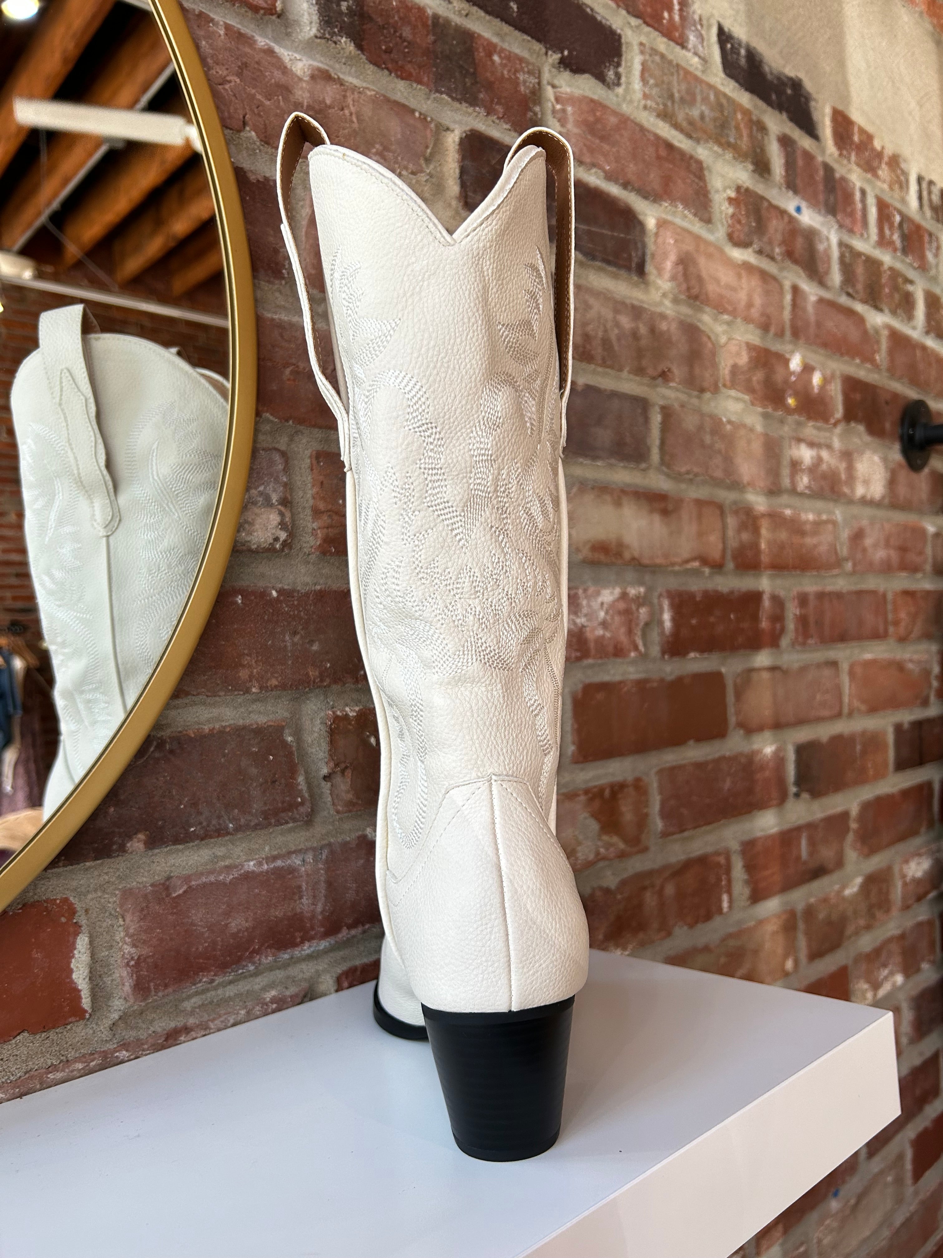Off white Western boot with tonal embroidery, pointed toe, and stacked block heel