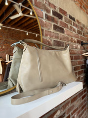 Palmer Beige Leather Shoulder Bag with short shoulder strap and adjustable long crossbody strap