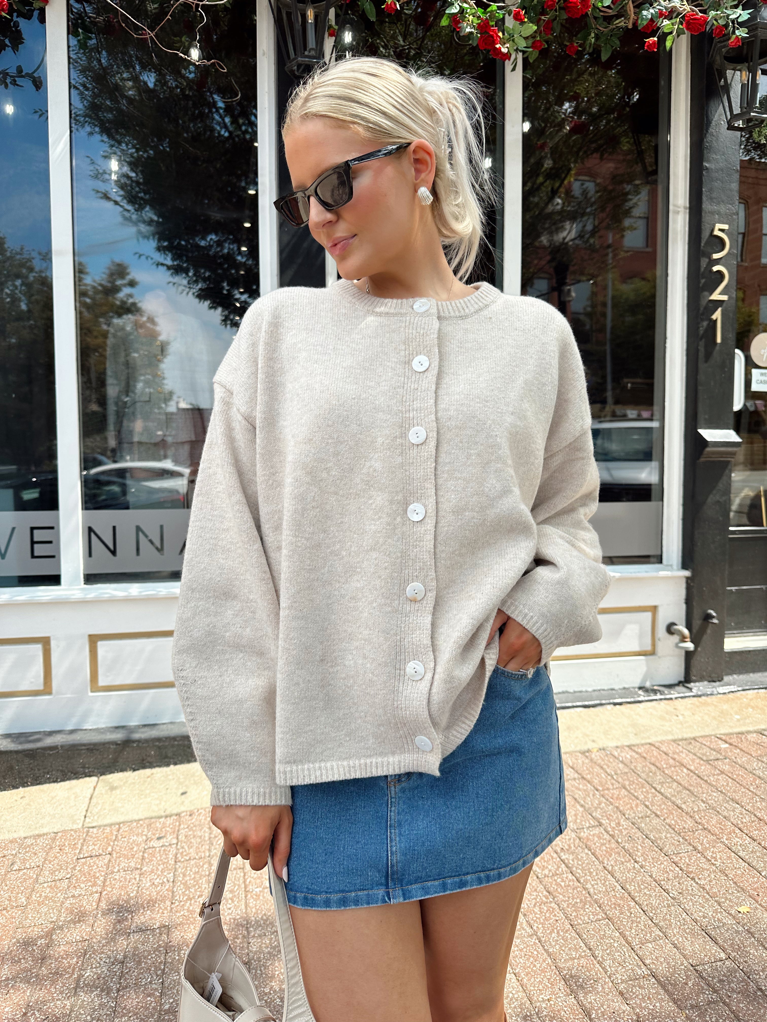 Oatmeal colored balloon sleeve button down cardigan. 