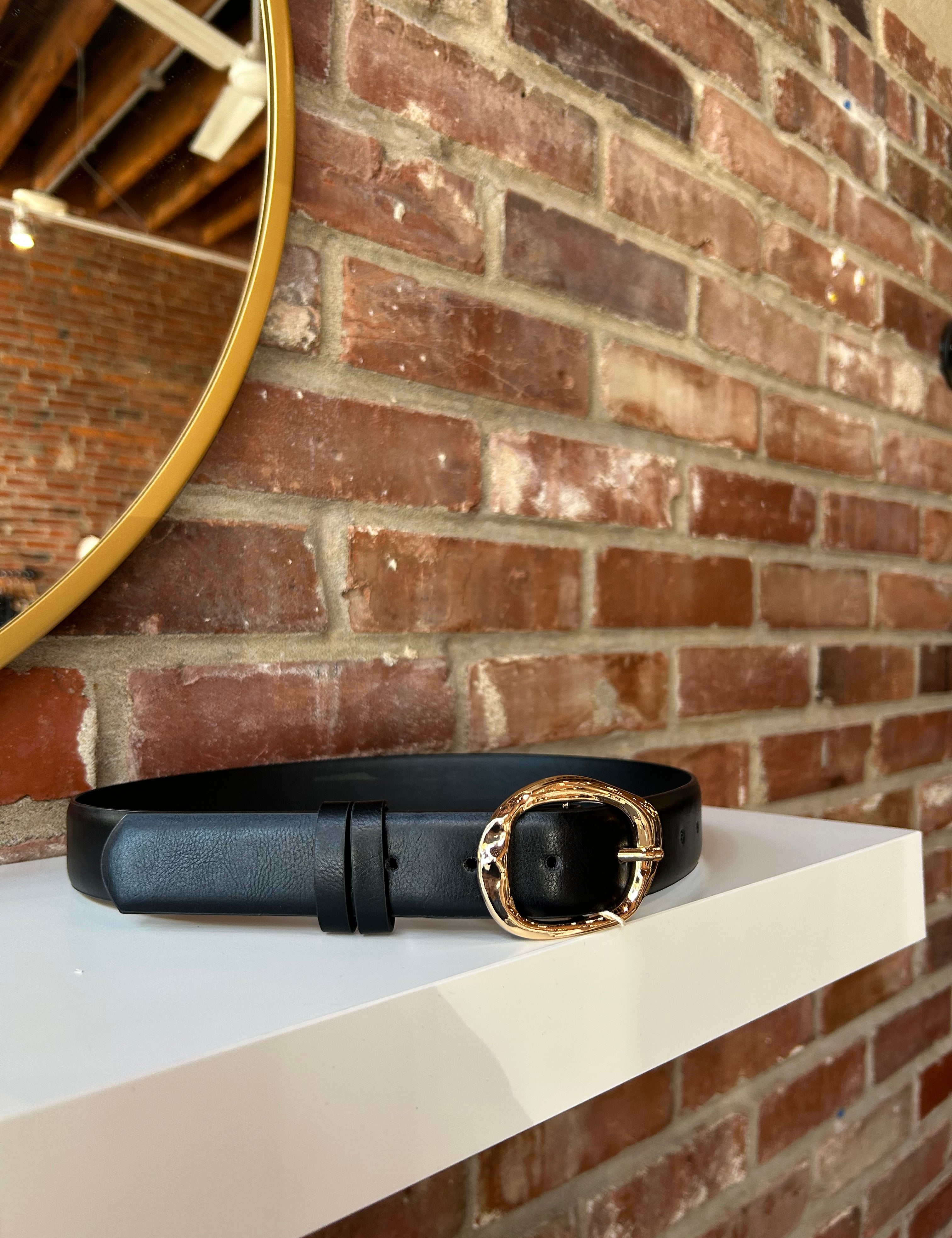 Black leather belt with gold hardware buckle.