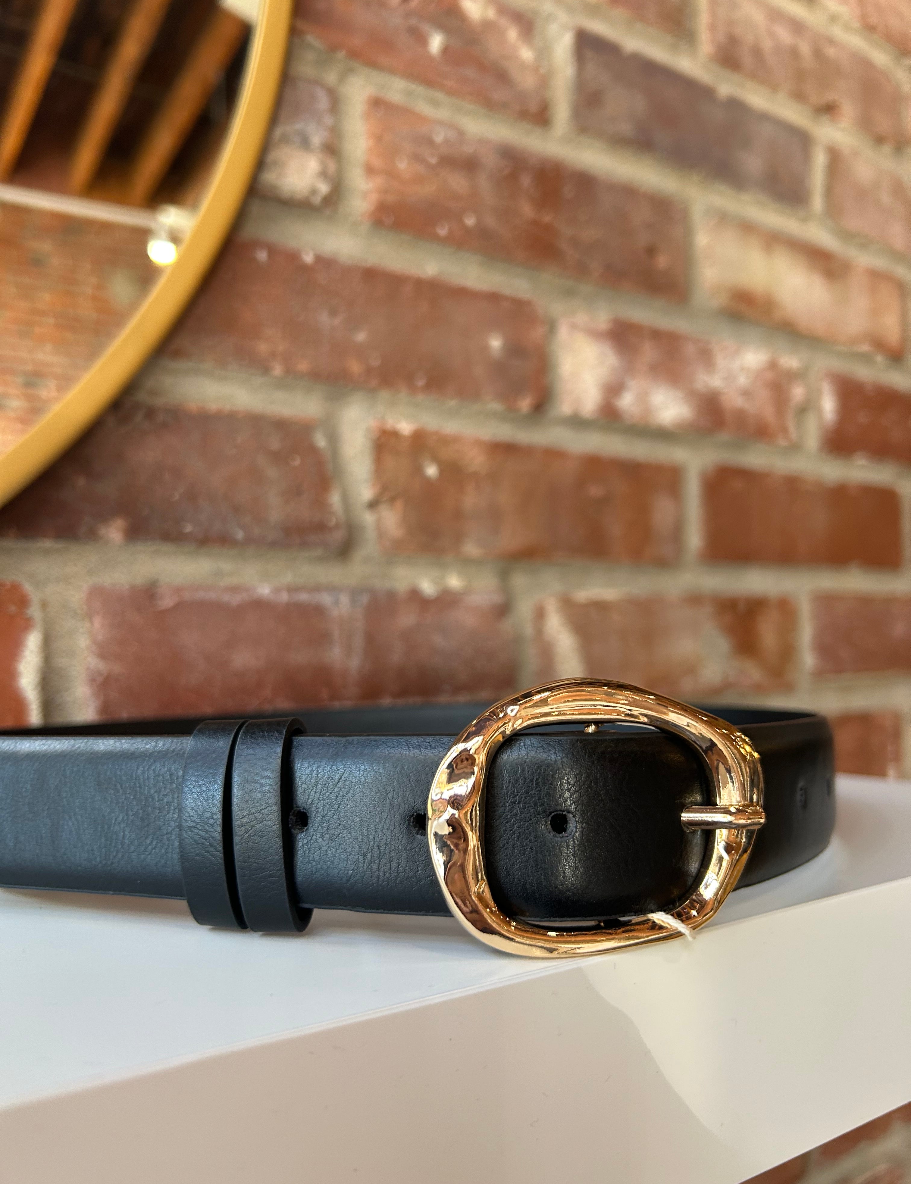 Black leather belt with gold hardware buckle.
