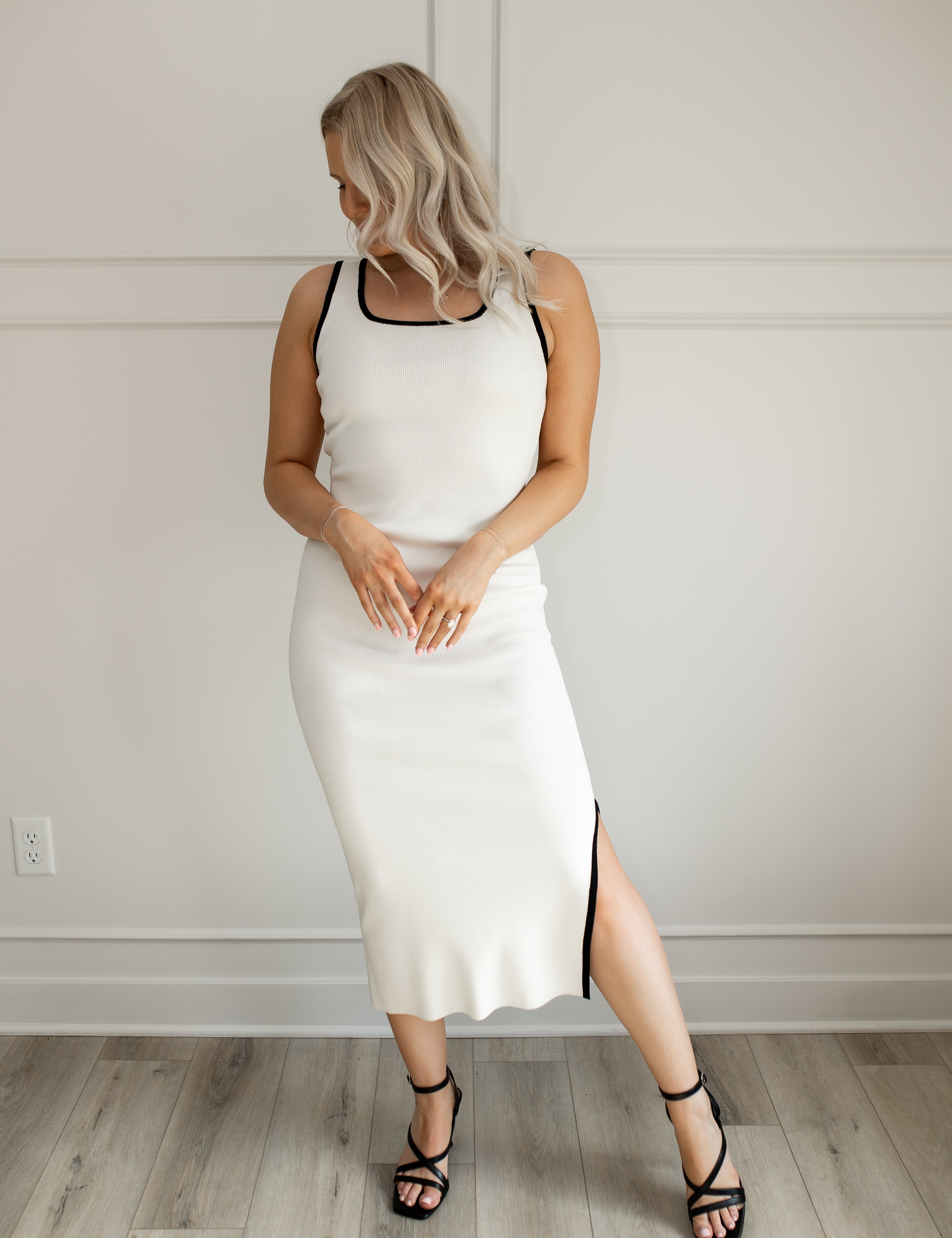 White ribbed midi dress with black trim and side slit detail