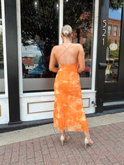 Orange floral mesh maxi dress with criss-cross back.