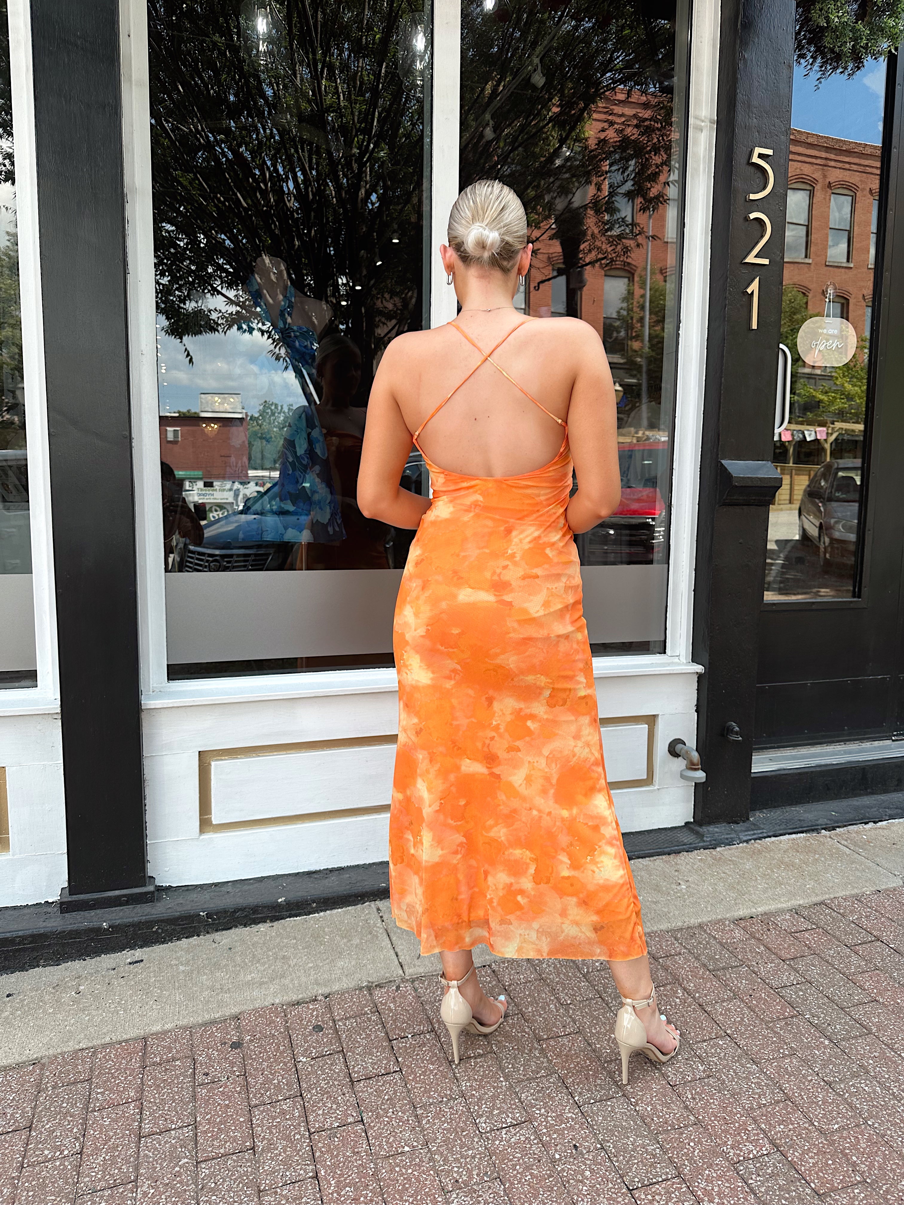 Orange floral mesh maxi dress with criss-cross back.