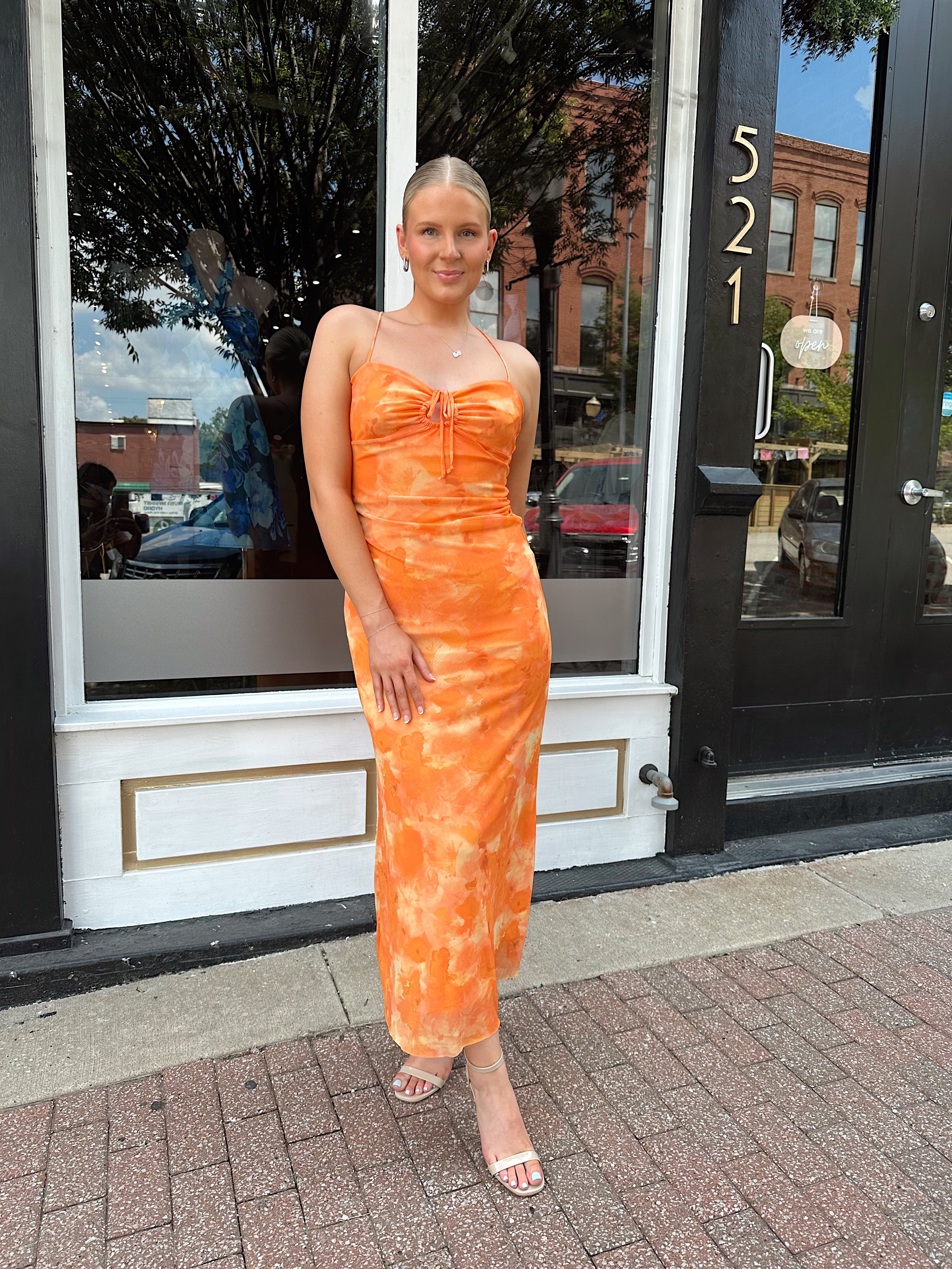 Orange floral mesh maxi dress with criss-cross back.