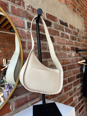 Reese Bone Leather Shoulder Bag with curved minimalist silhouette and sleek soft bone leather finish