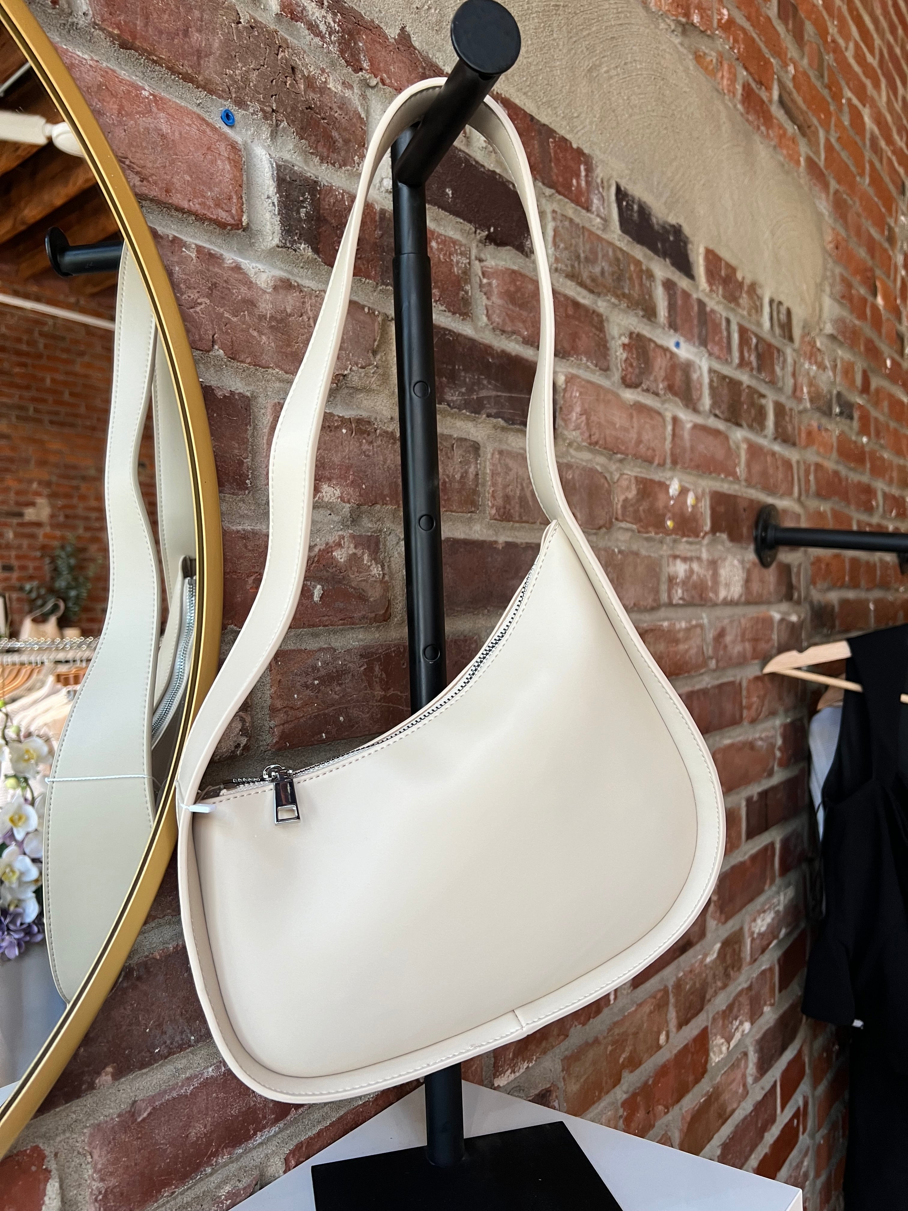 Reese Bone Leather Shoulder Bag with curved minimalist silhouette and sleek soft bone leather finish