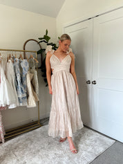 Champagne embroidered floral midi dress with ruffles, side cutouts, and lace-up open back