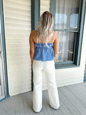 Blue and white striped tube top with elastic neckline and tie detail.