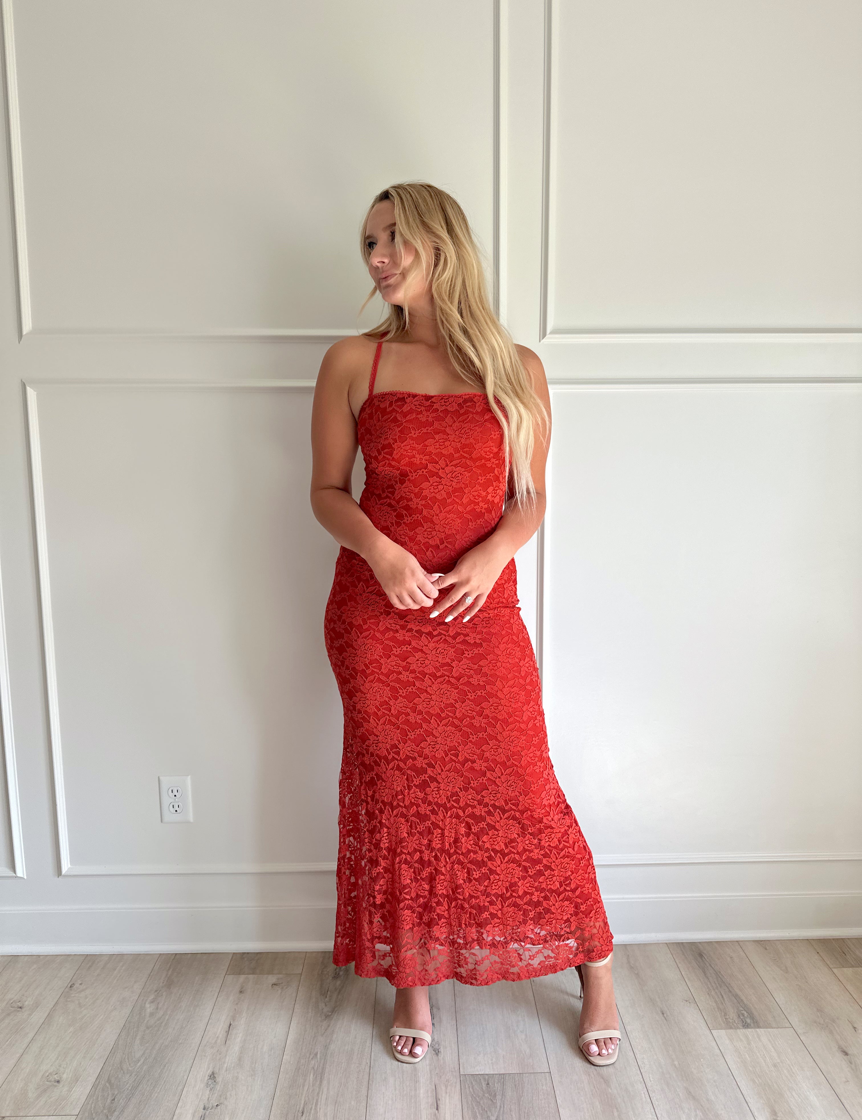 Rust colored lace bodycon maxi dress with thin straps.