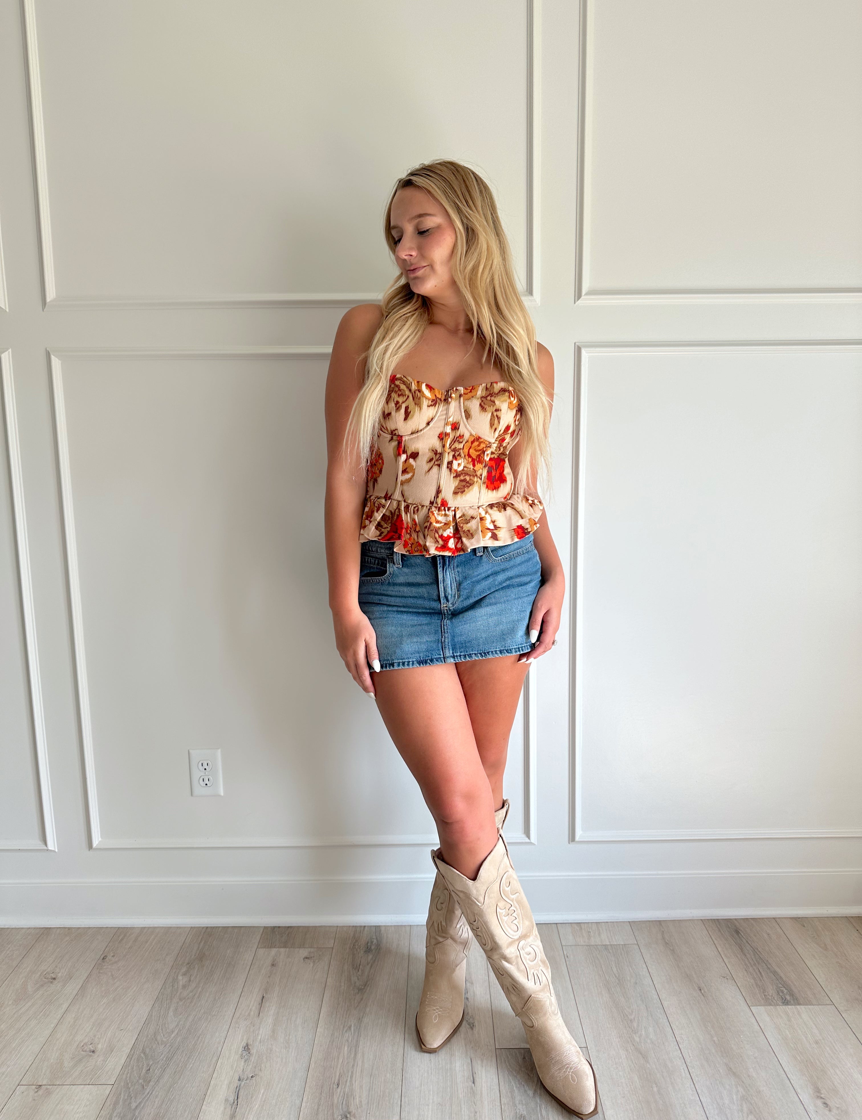 Orange and brown floral strapless peplum corset top.