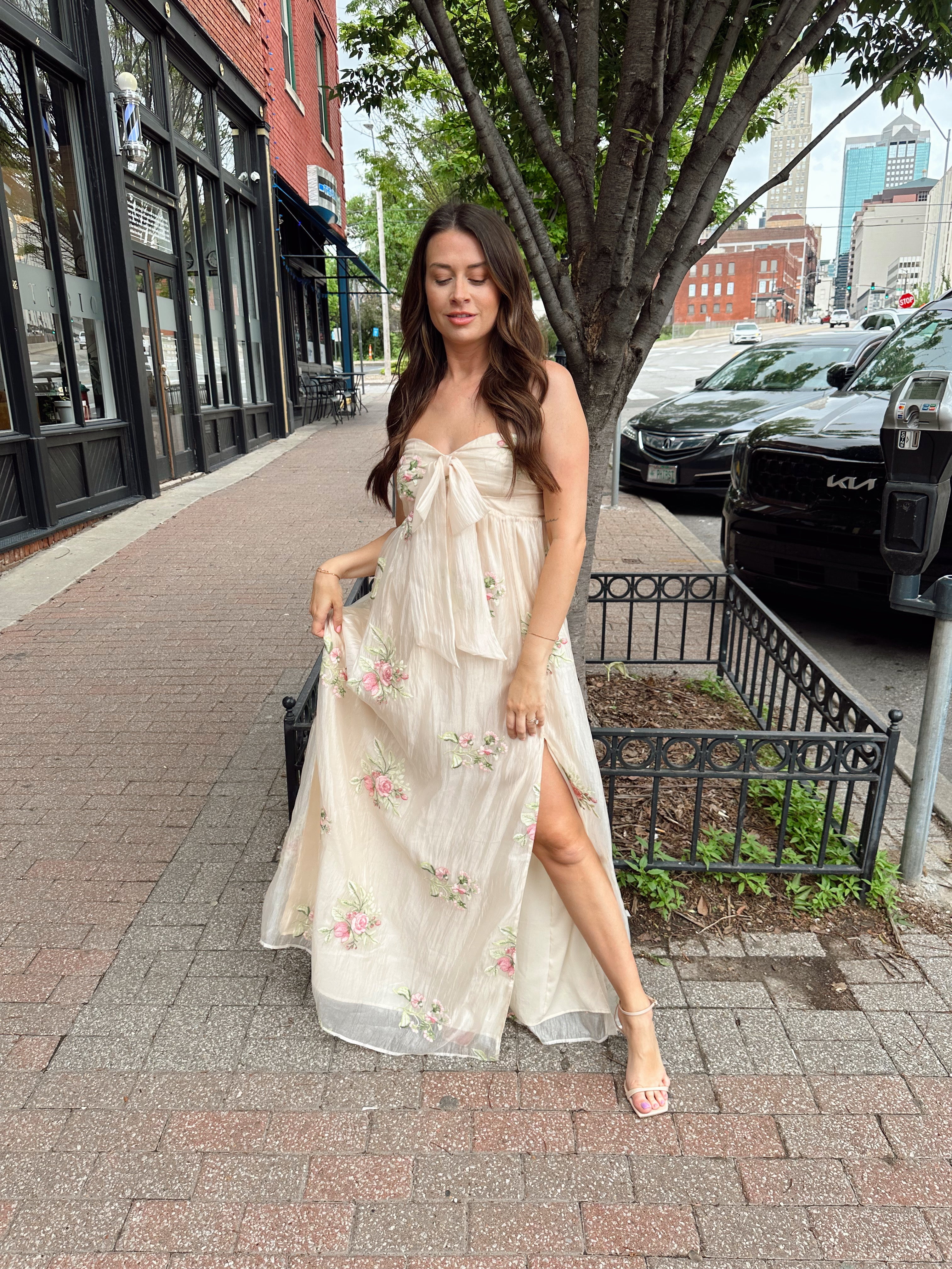 Strapless beige chiffon maxi dress with pink floral embroidery and leg slit