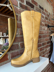 Camel colored vegan leather knee boot with block heel.