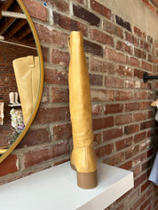 Camel colored vegan leather knee boot with block heel.