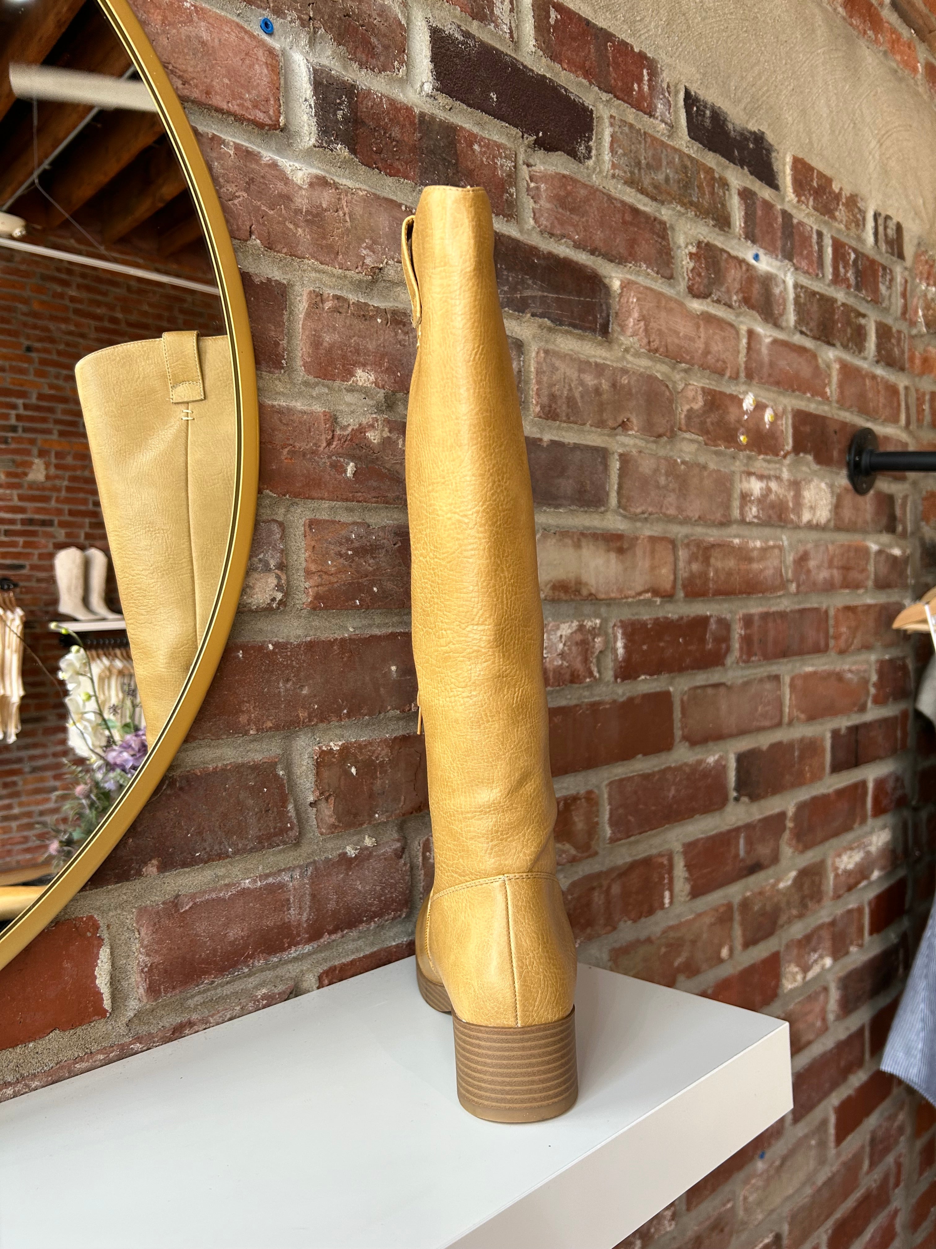 Camel colored vegan leather knee boot with block heel.