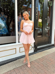Light pink linen mini dress with iridescent beading detail.