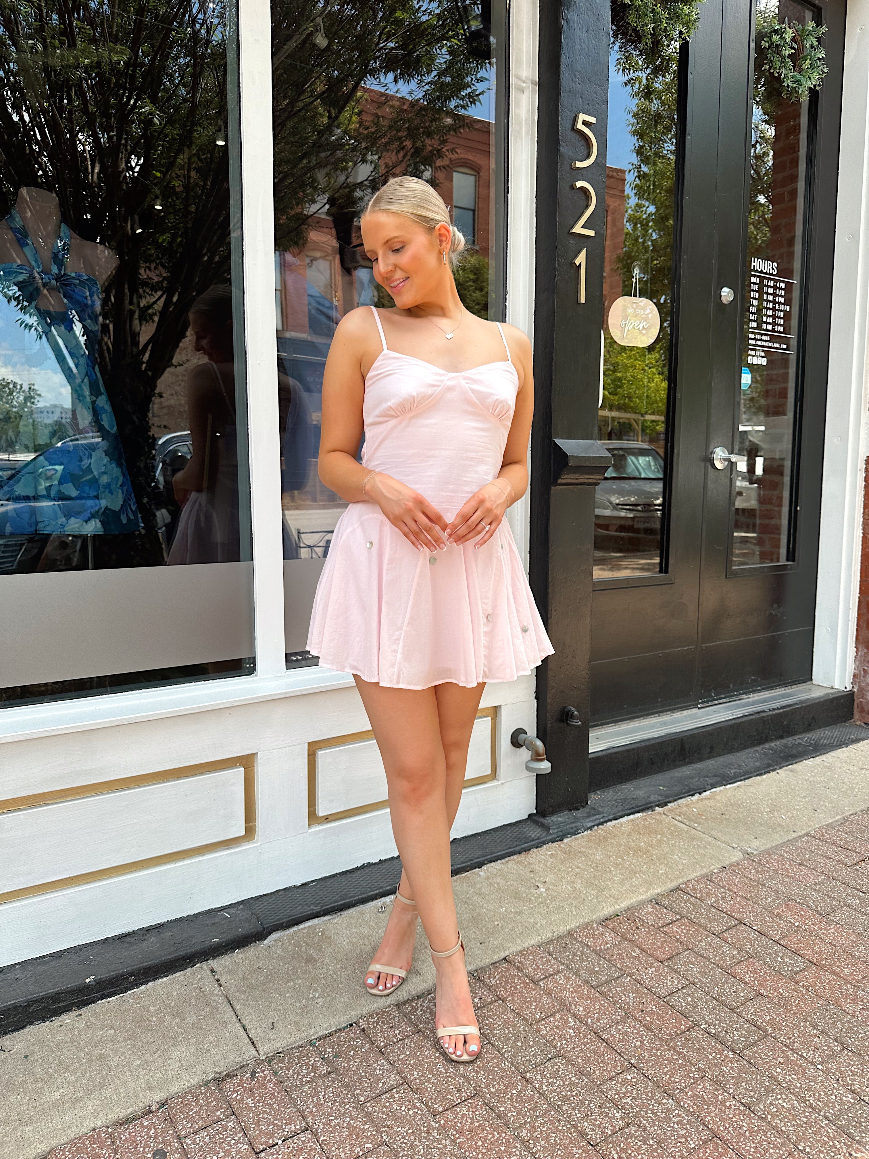 Light pink linen mini dress with iridescent beading detail.