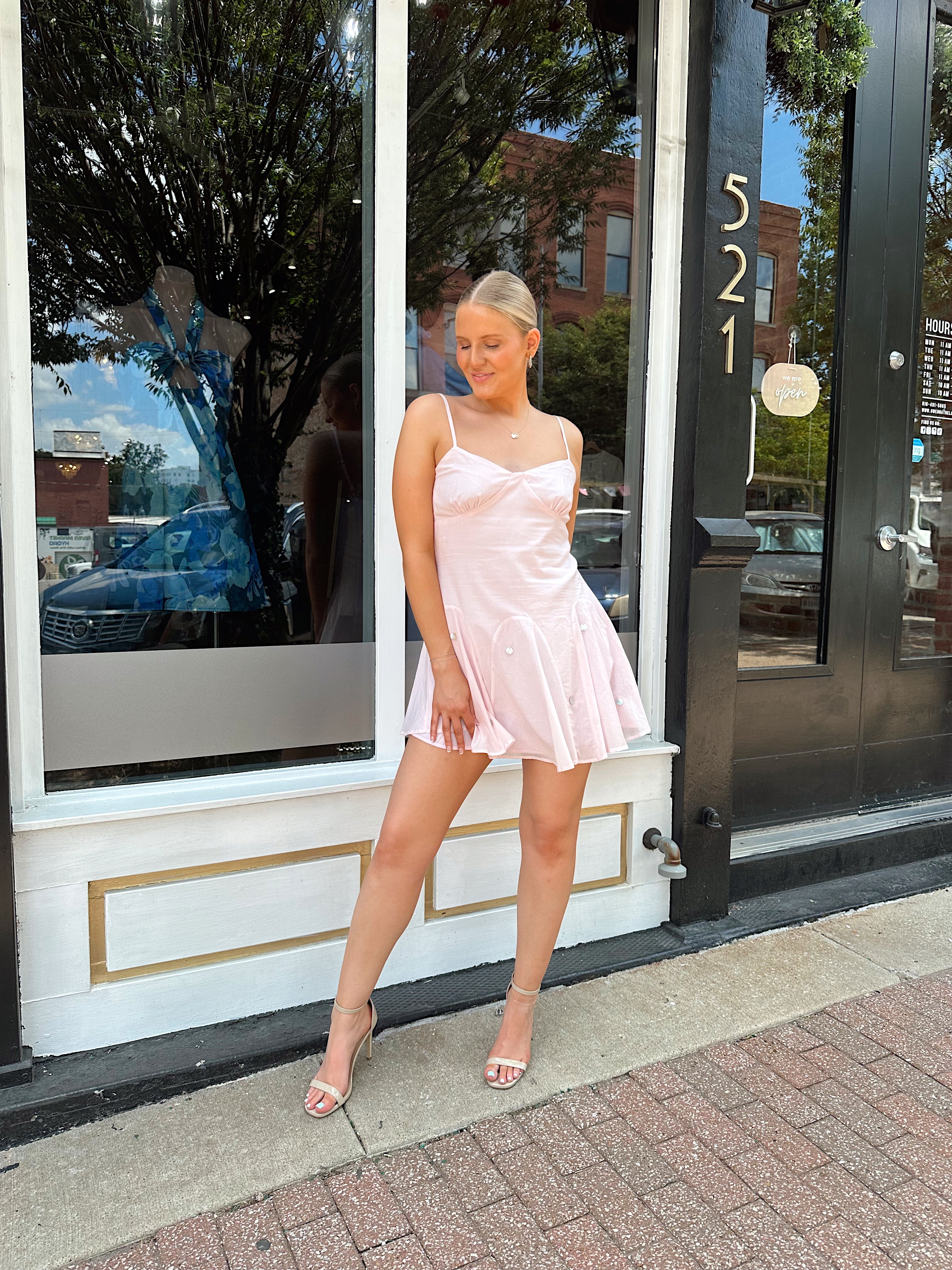 Light pink linen mini dress with iridescent beading detail.