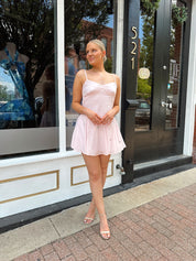 Light pink linen mini dress with iridescent beading detail.