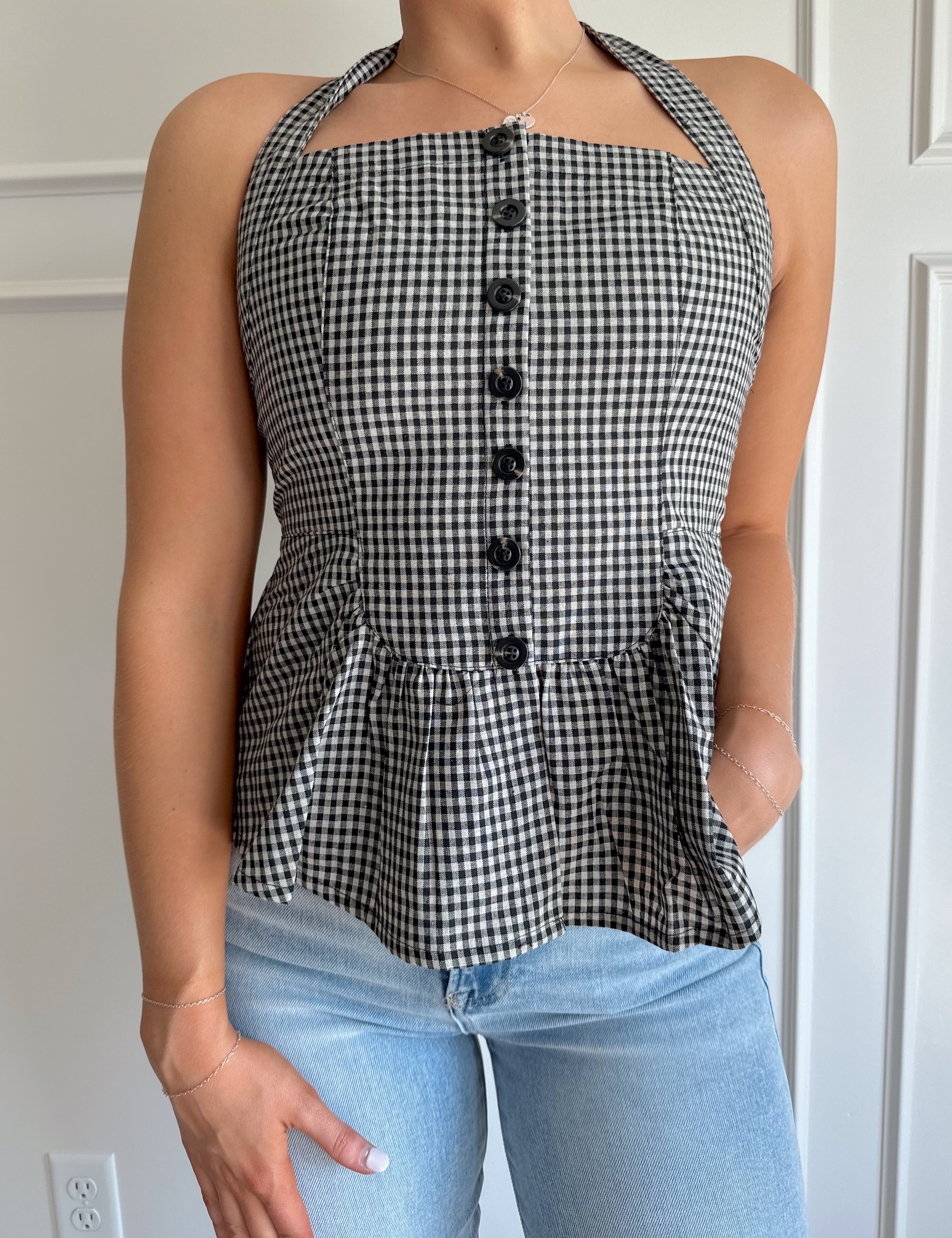 Black and White checkered top with halter neck, and button detailing.