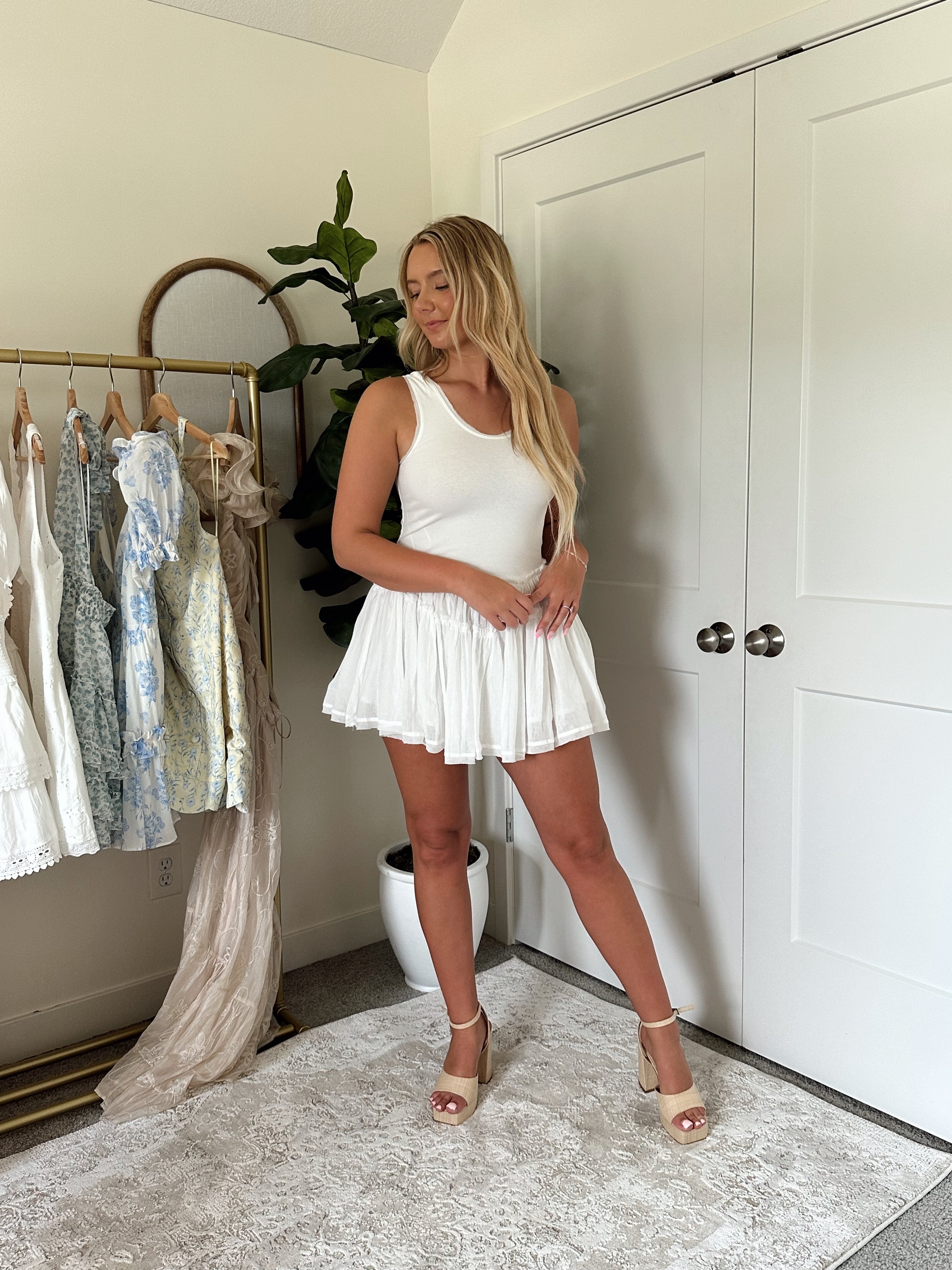 White scoop neck mini dress with lace trim detailing.