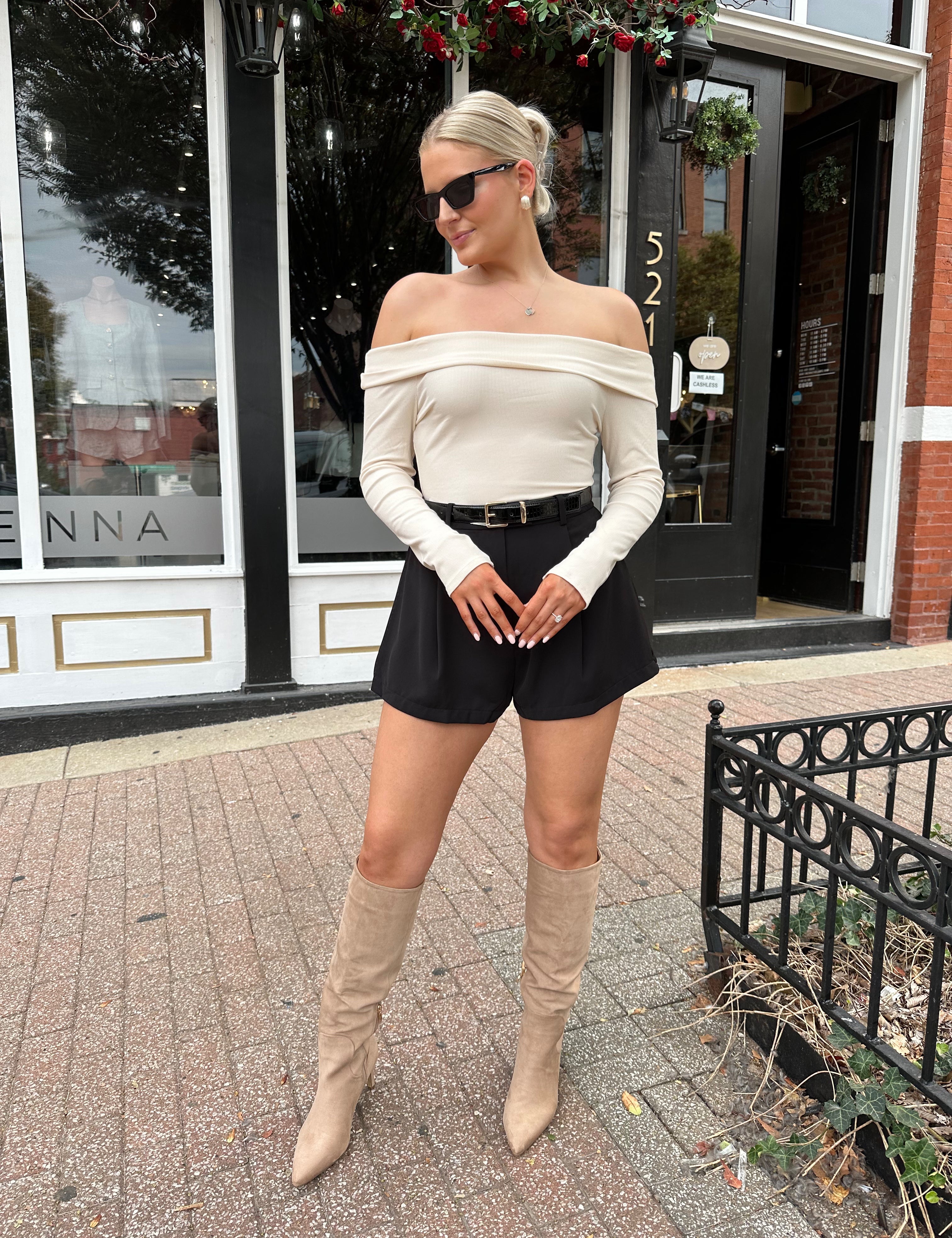 Cream colored ribbed long sleeve off the shoulder bodysuit. 