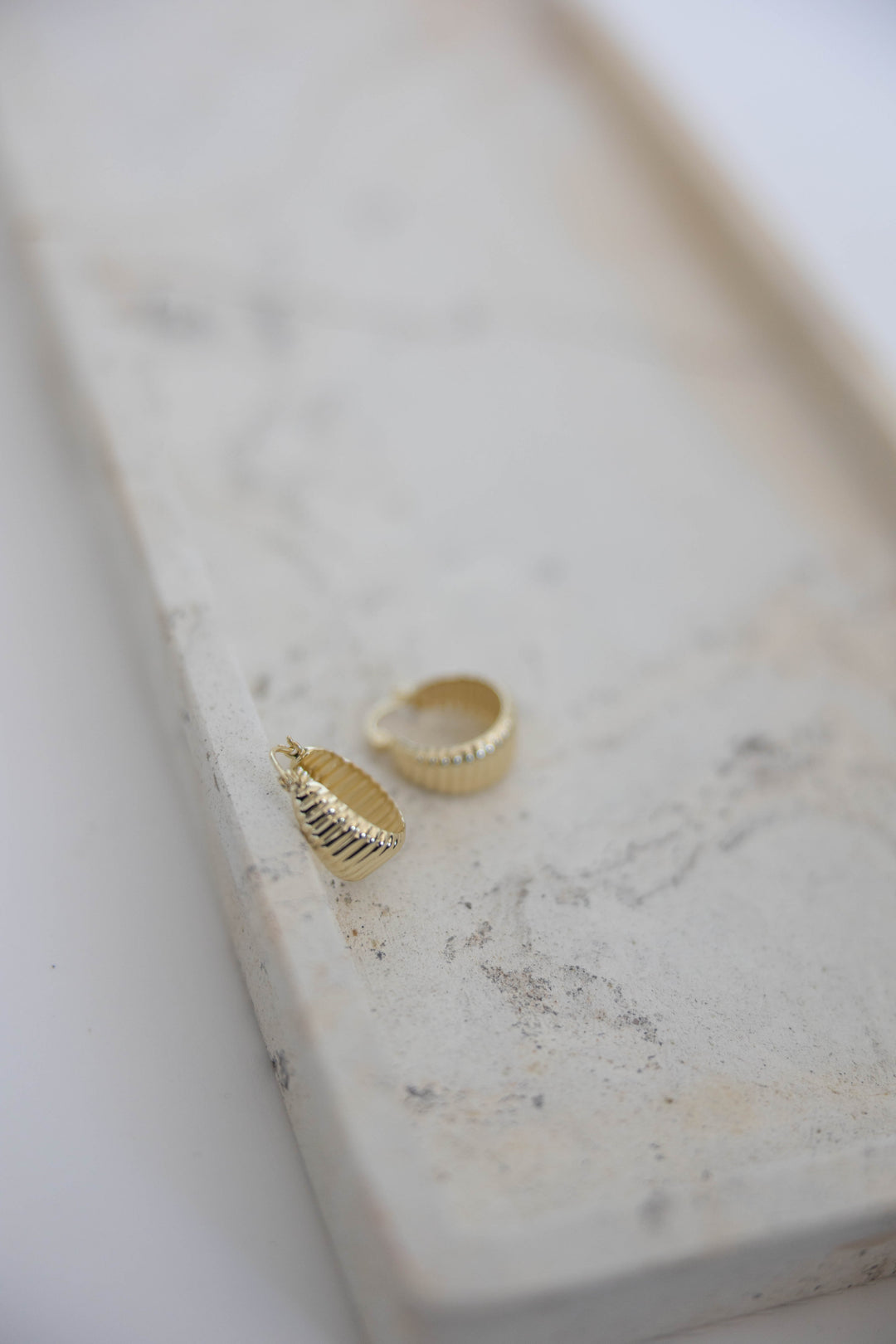 Gold plated textured hoop.