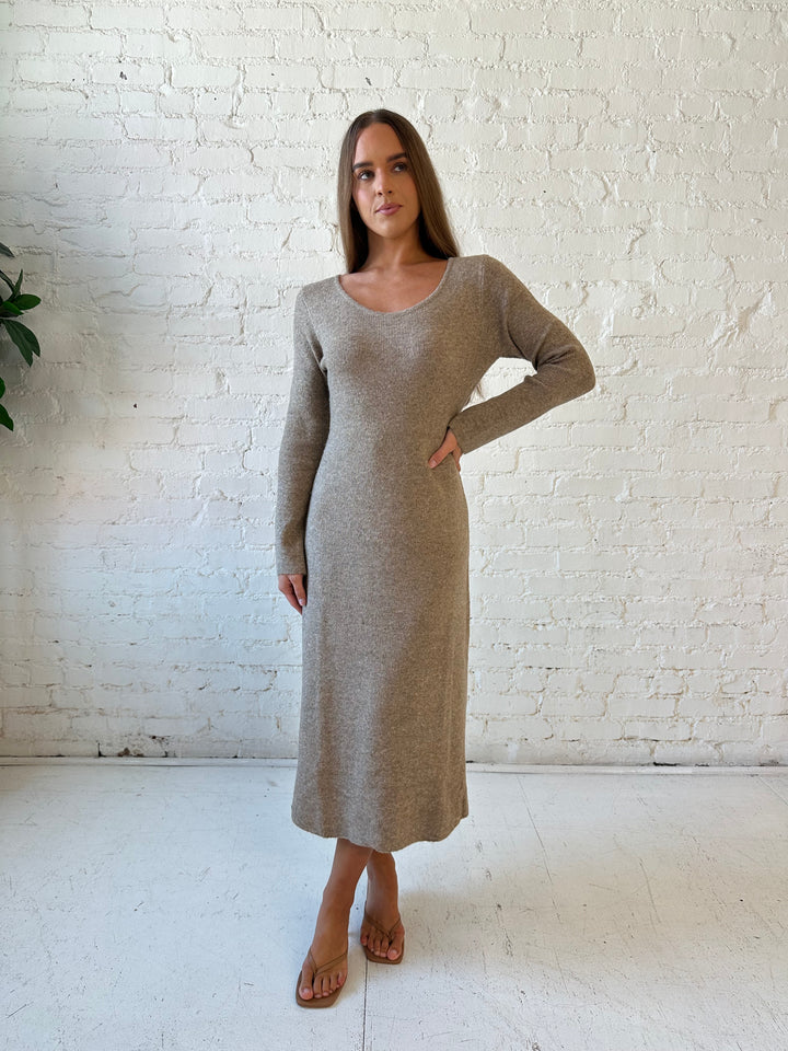Woman wearing taupe knit sweater midi dress with heels. 