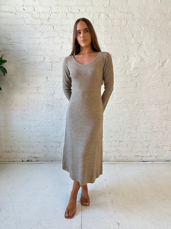 Woman wearing taupe knit sweater midi dress with heels. 