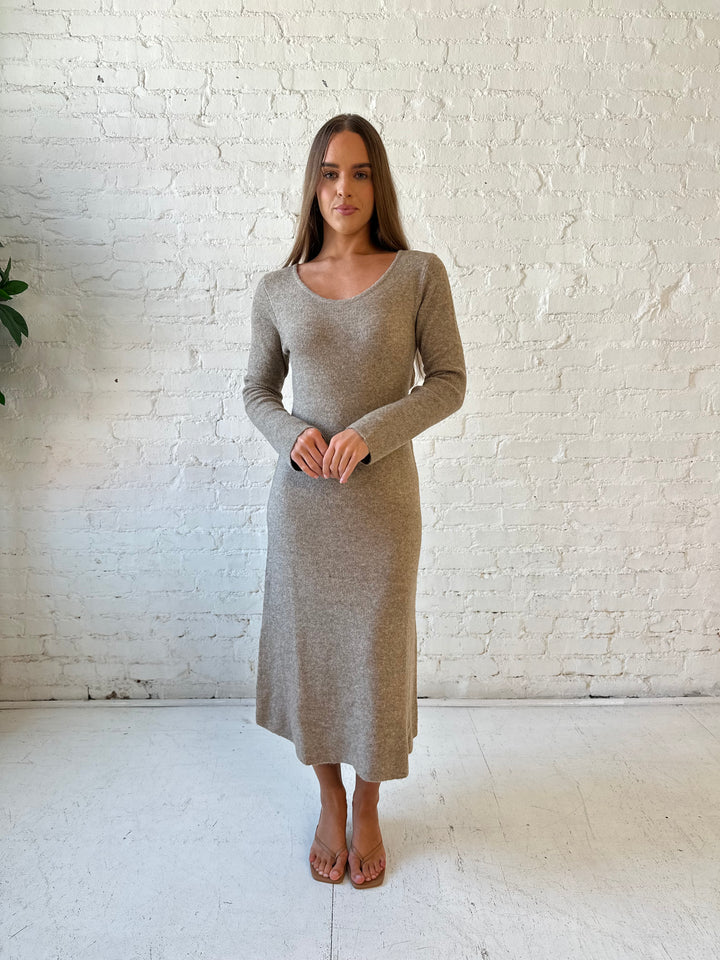Woman wearing taupe knit sweater midi dress with heels. 