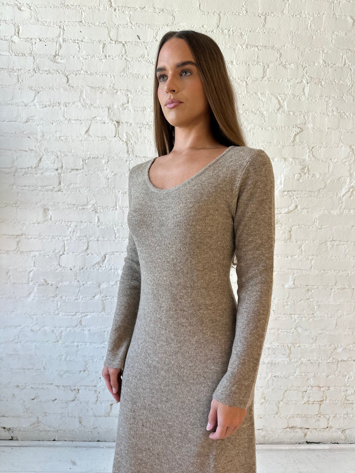 Woman wearing taupe knit sweater midi dress with heels. 
