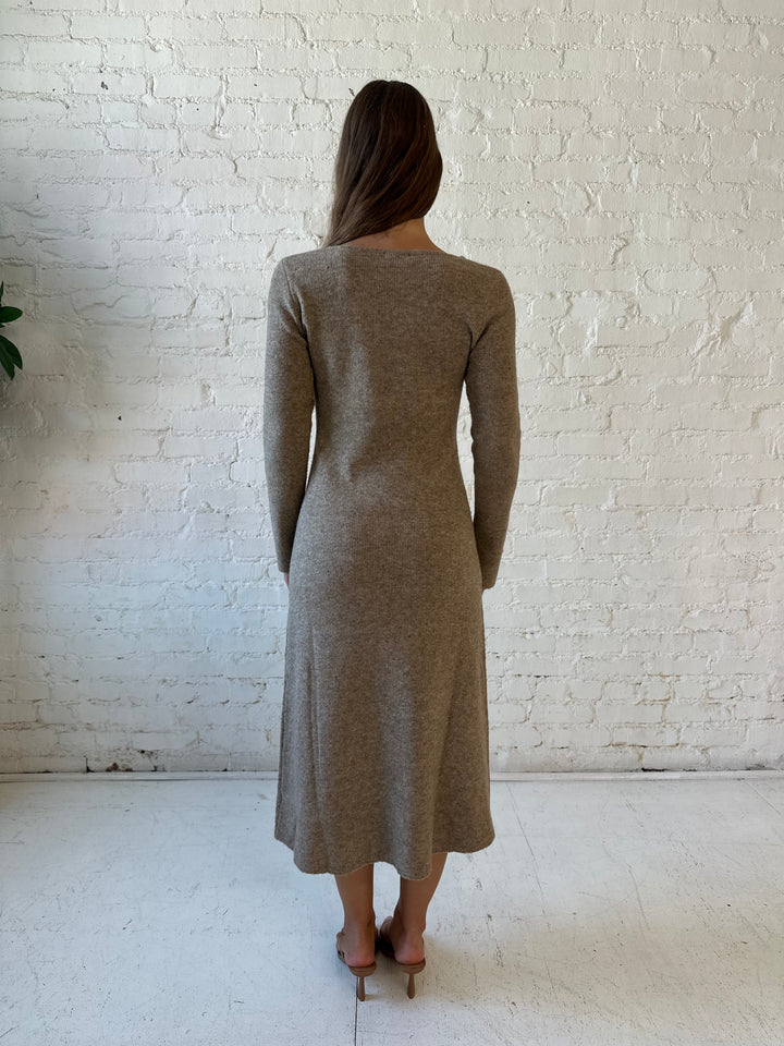 Woman wearing taupe knit sweater midi dress with heels. 
