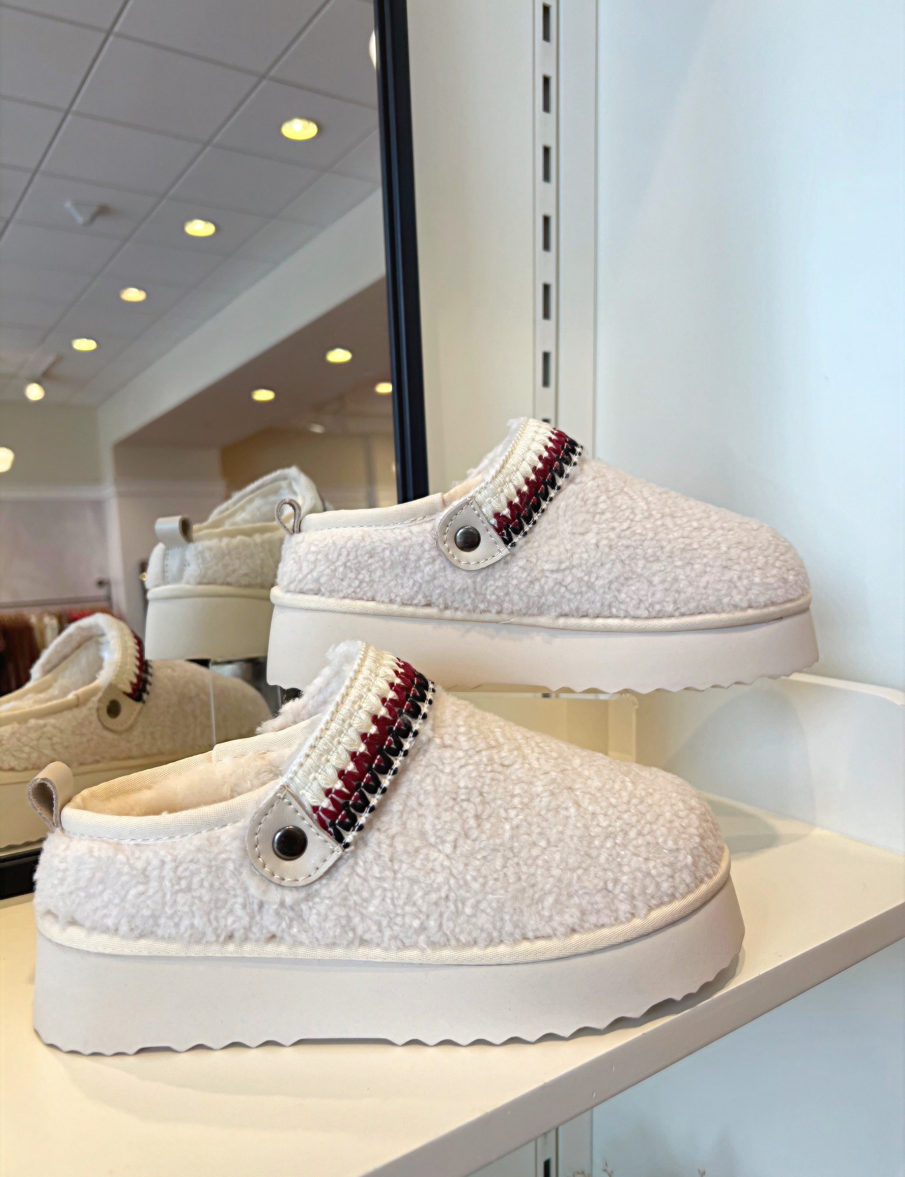 Ivory Slip On Sherpa Clogs.