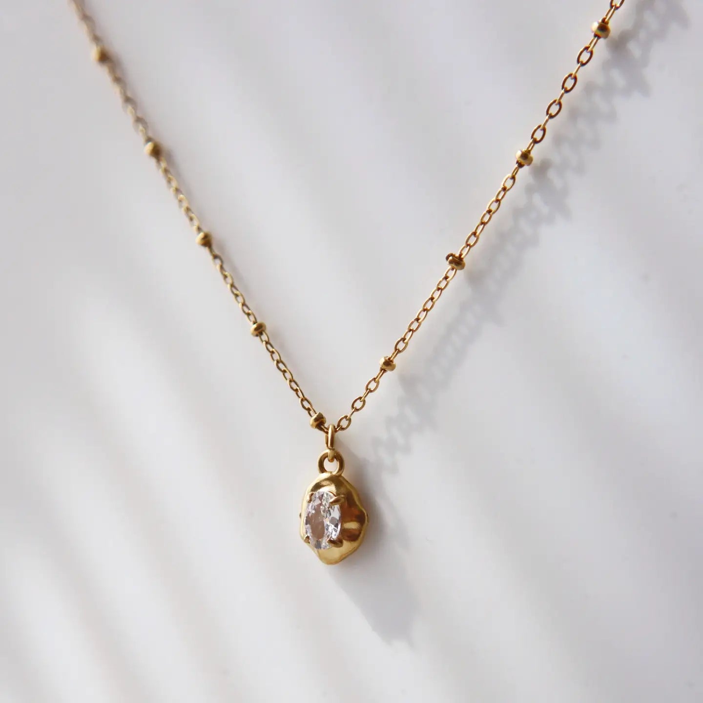 Raina Pebble Gold Plated Necklace.